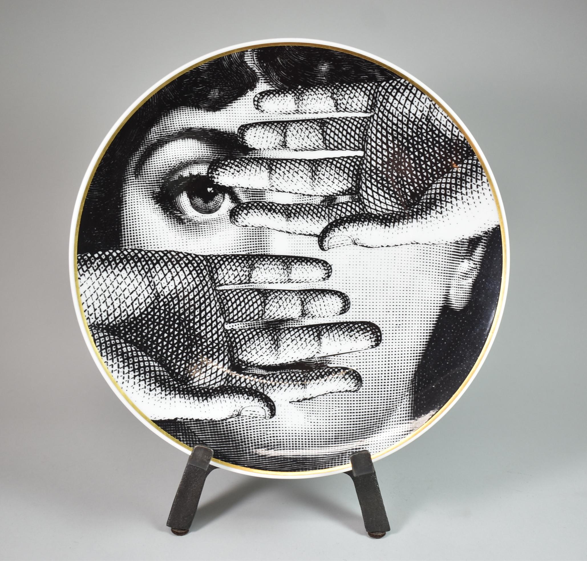 Six black and white Fornasetti plates 