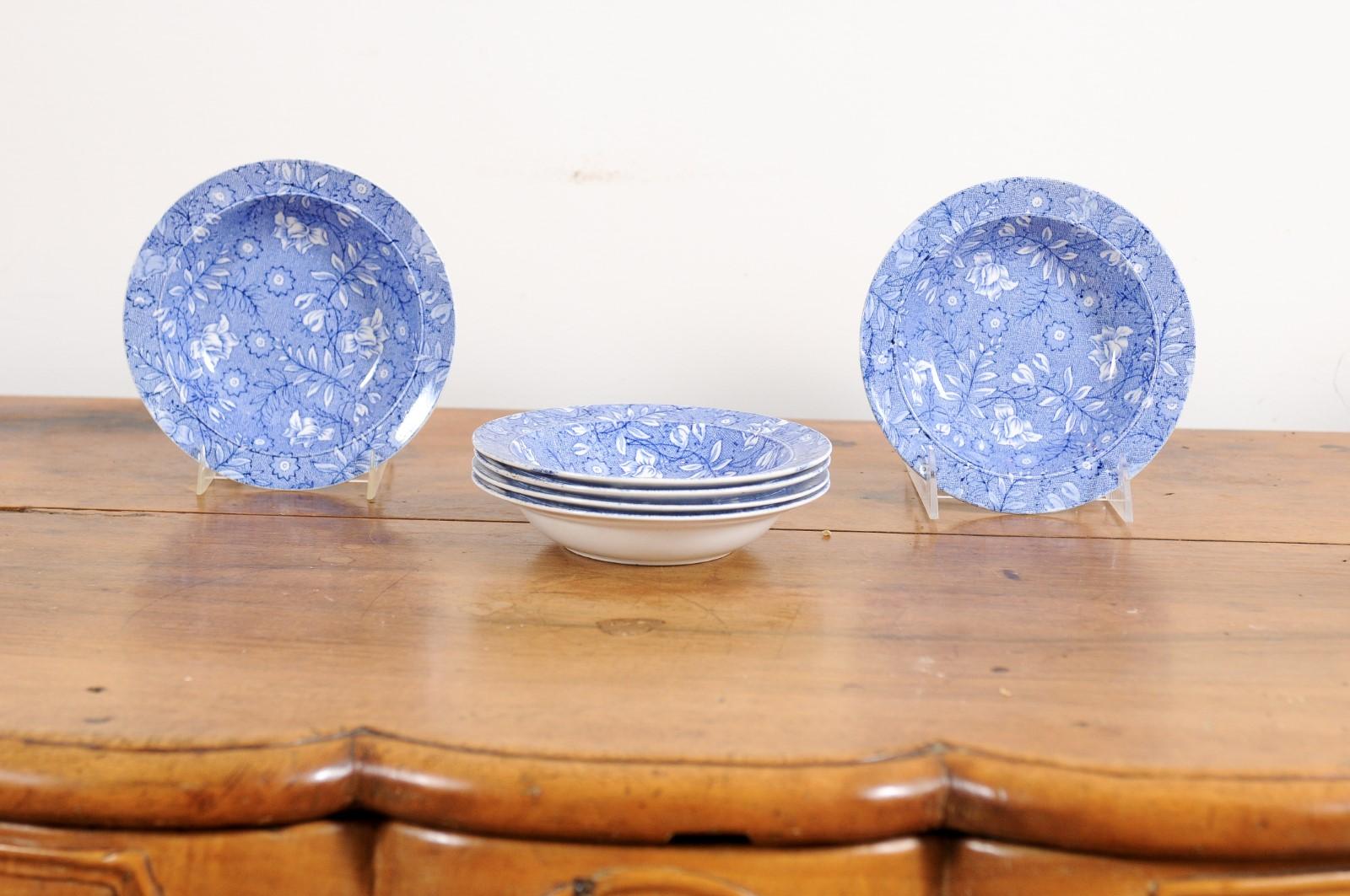 A set of six Royal Tudor Ware blue and white porcelain bowls from the late 19th century, with floral pattern. Created in England during the last quarter of the 19th century, each of this set of six small porcelain bowls features a blue and white