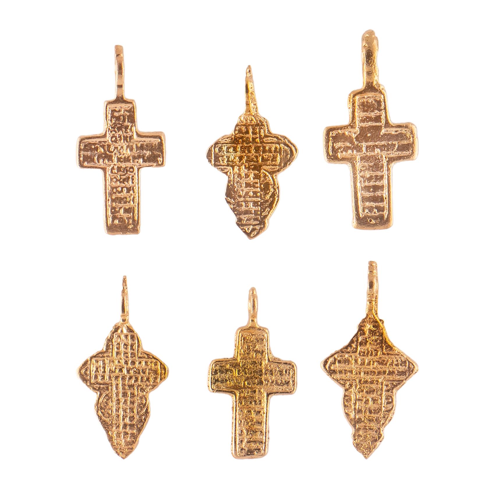 A group of rare gilded Russian Old Believers’ pendant crosses from the era of the Romanovs. Each with stamped religious motifs including a Russian Orthodox cross on the front and an inscription in the back (illegible). Traditionally the inscription