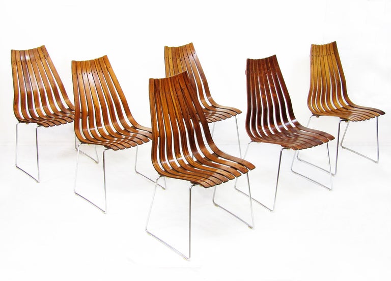 Six original 1960s rosewood Scandia chairs by Hans Brattrud for Hove Mobler.

These graceful chairs are in excellent structural and aesthetic condition. They would perfectly suit our Hans Brattrud dining table.

In 1967 the Scandia stackable