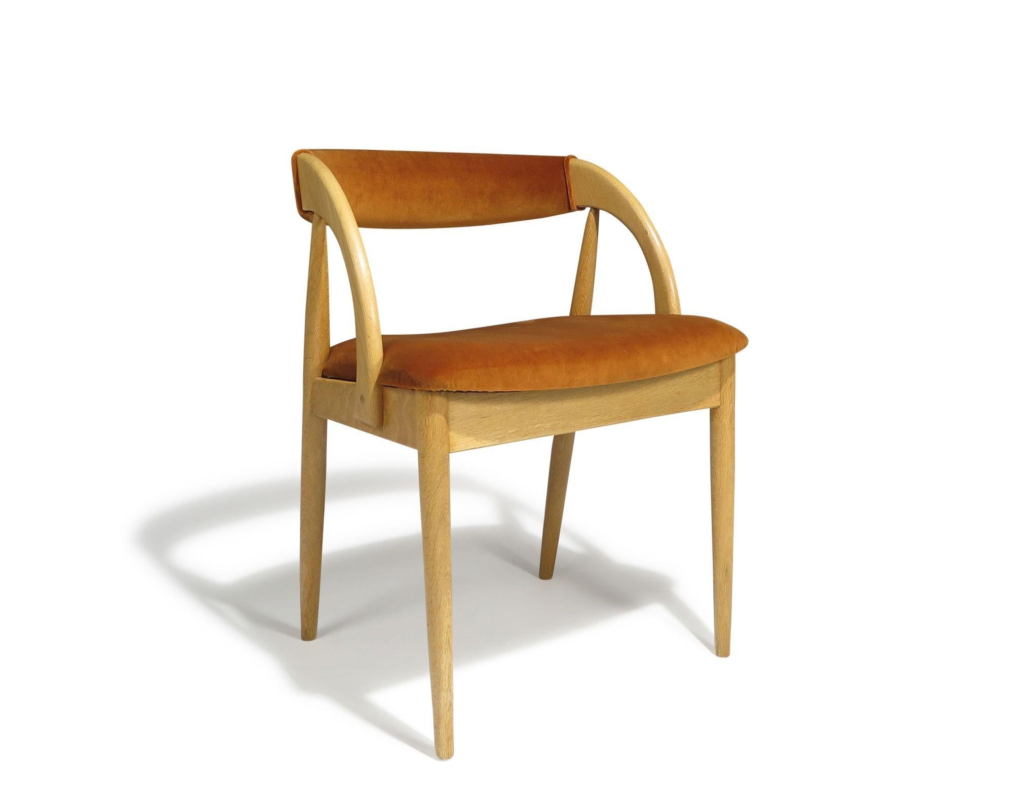 Set of six Mid-century Danish-designed dining chairs crafted from white oak, featuring sculptural frames with dramatic sloping arms and comfortable curved backrests. Fully reupholstered in Holland & Sherry cotton velvet, these chairs have been