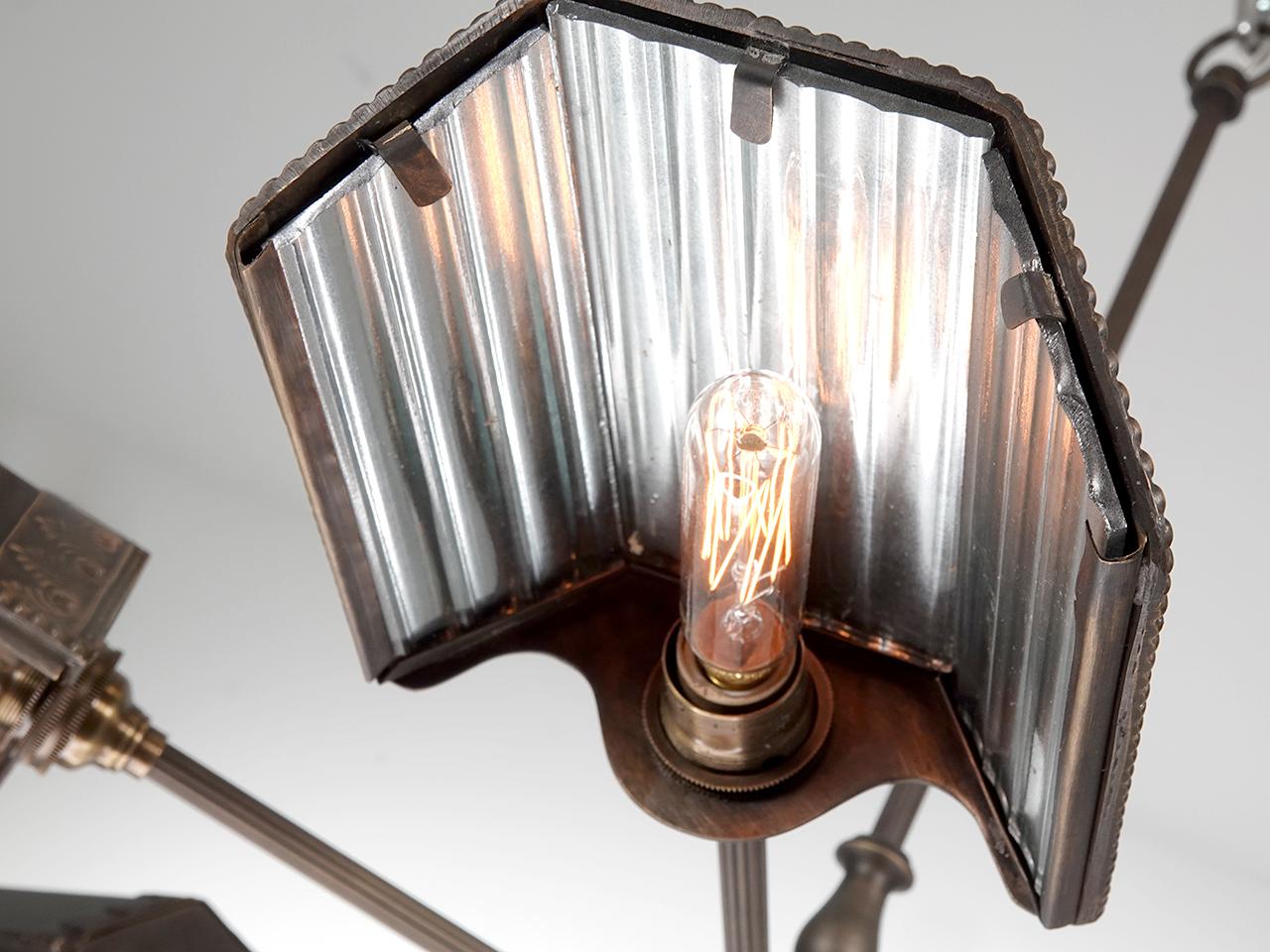 We were inspired The earliest reflector lamps manufactured by the companies Frink and Wheeler. over 100 years ago these small mirrored shades could be found lining a Vaudeville stage and were known as Foot Lights. Each shade contains 3 shallow