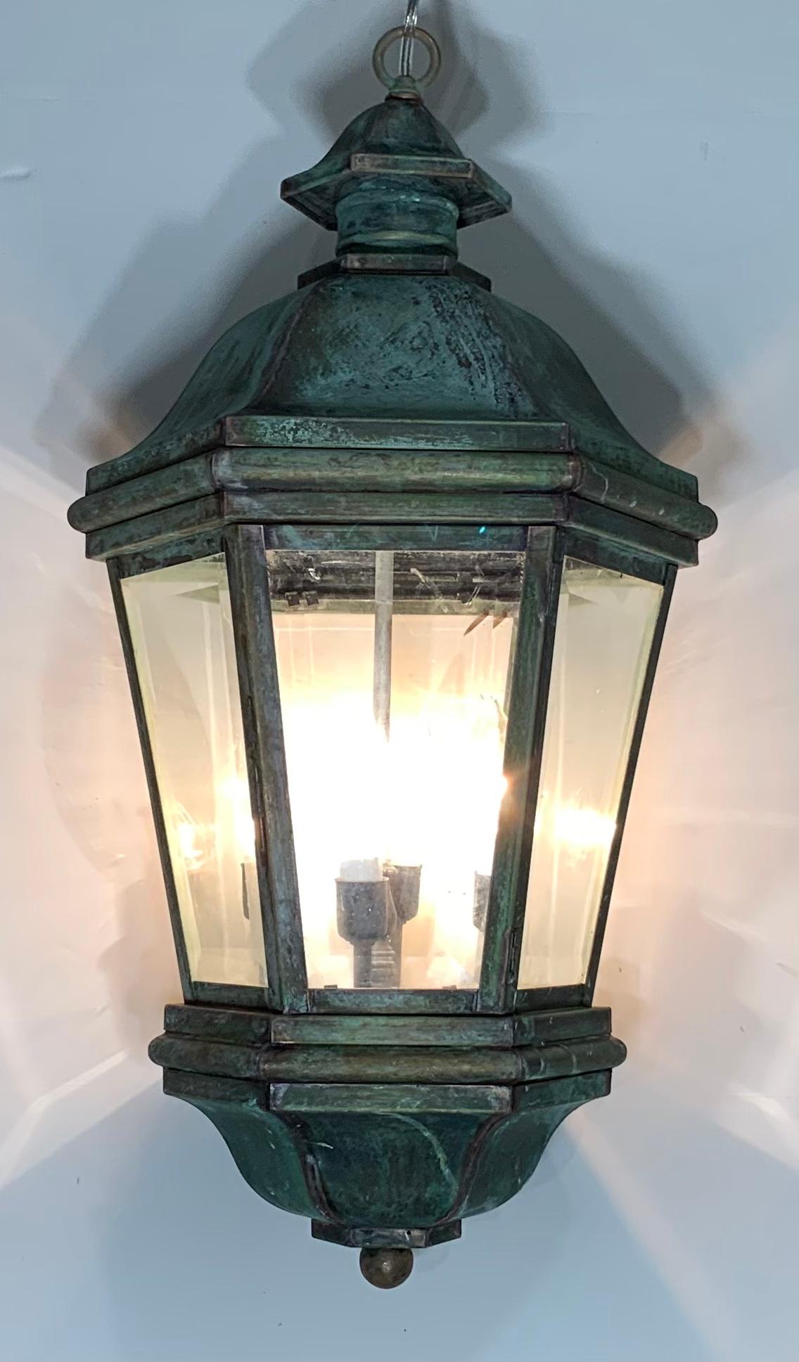 Elegant handcrafted lantern made of solid brass with great green patina color, six sides of beveled glass.
Electrified with Four 40/watt lights, good for wet locations, although could be used also as decorative indoor light. Canopy included.