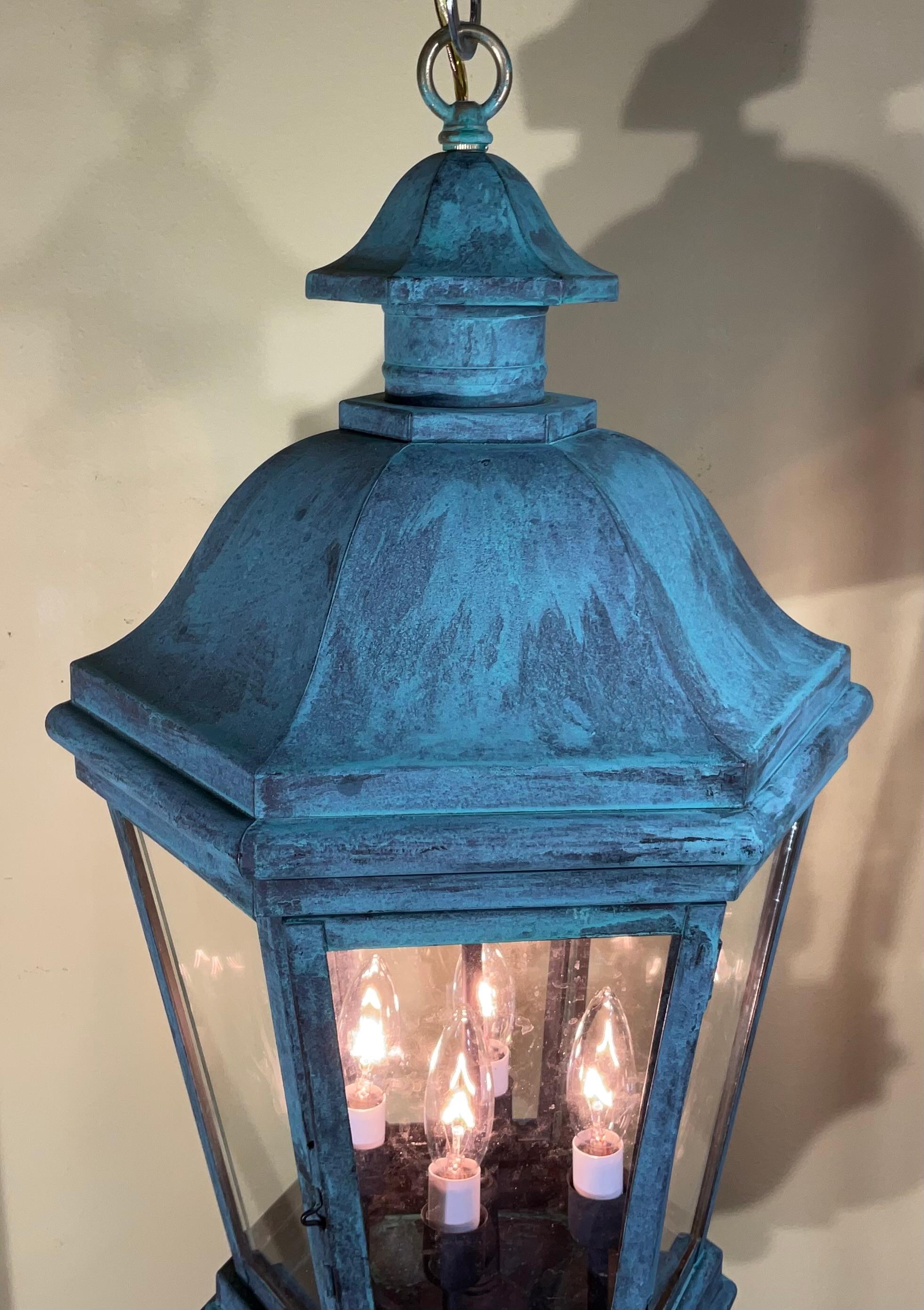 Elegant handcrafted lantern made of solid brass with great patina , six sides of glass.
Electrified with Four - 40/watt lights, good for wet locations, could be used also as decorative indoor light. 
Canopy and chain included.