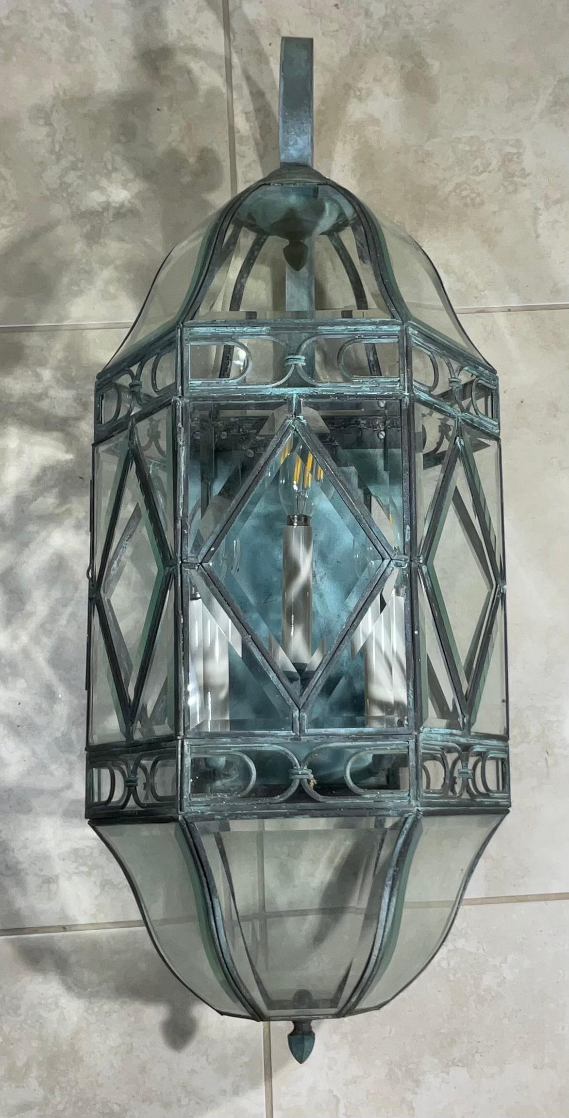 Beautiful hanging lantern made of solid brass with interact thick beveled glass artistic work, That give great Light reflection when it’s on.
Six 40/watt lights.