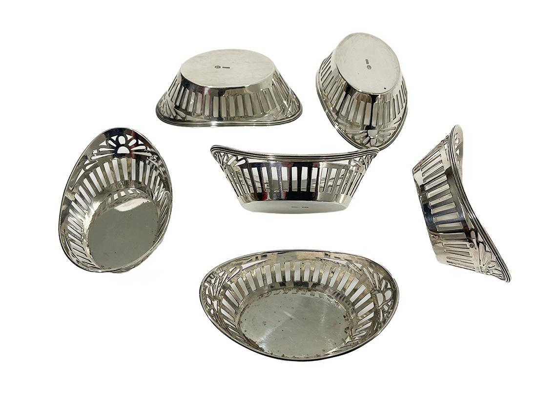 Six silver miniature bonbon baskets, Bonebakker, Amsterdam,1928

Six silver very small bonbon baskets in boat shape and openwork. Dutch silver, made by Carl Bonebakker & Son, Amsterdam in 1928. These small silver baskets are made to present one