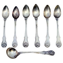 Six silver teaspoons and sugar scoop with shell-shaped relief handles