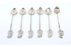 Six silver teaspoons with female figures on twisted handles and leaf shells