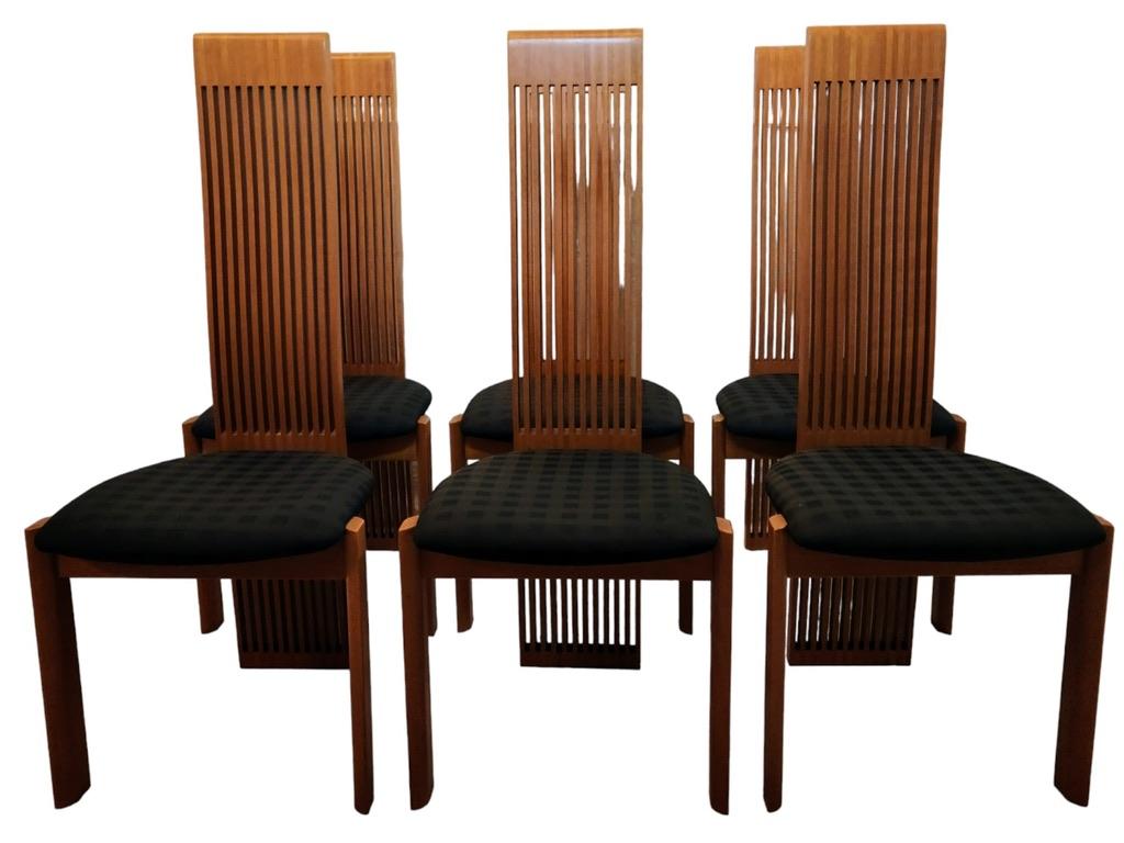 This set of six slat back maple steamed and laminated bentwood dining chairs are distinctly postmodern in style with tall slatted backrests with a tripod base..

Pietro Costantini opened his business in 1922 and his label has become synonymous with