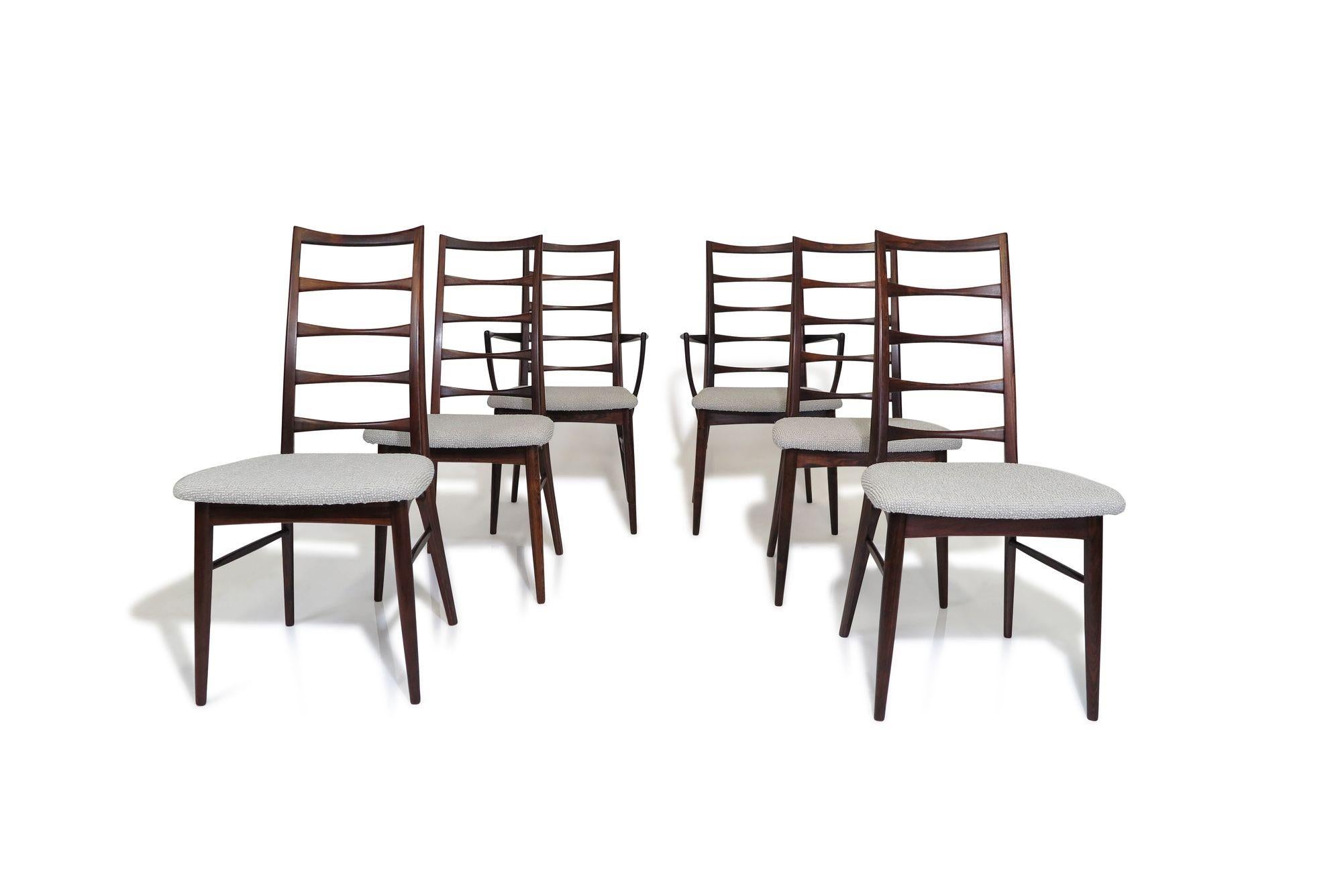 Set of six rosewood dining chairs designed by Niels Koefoed for Koefoeds Hornslet, model Lis, Denmark. The chairs are crafted of solid Brazilian rosewood with sculpted details and fine joinery. The set includes four side chairs and two arm chairs.