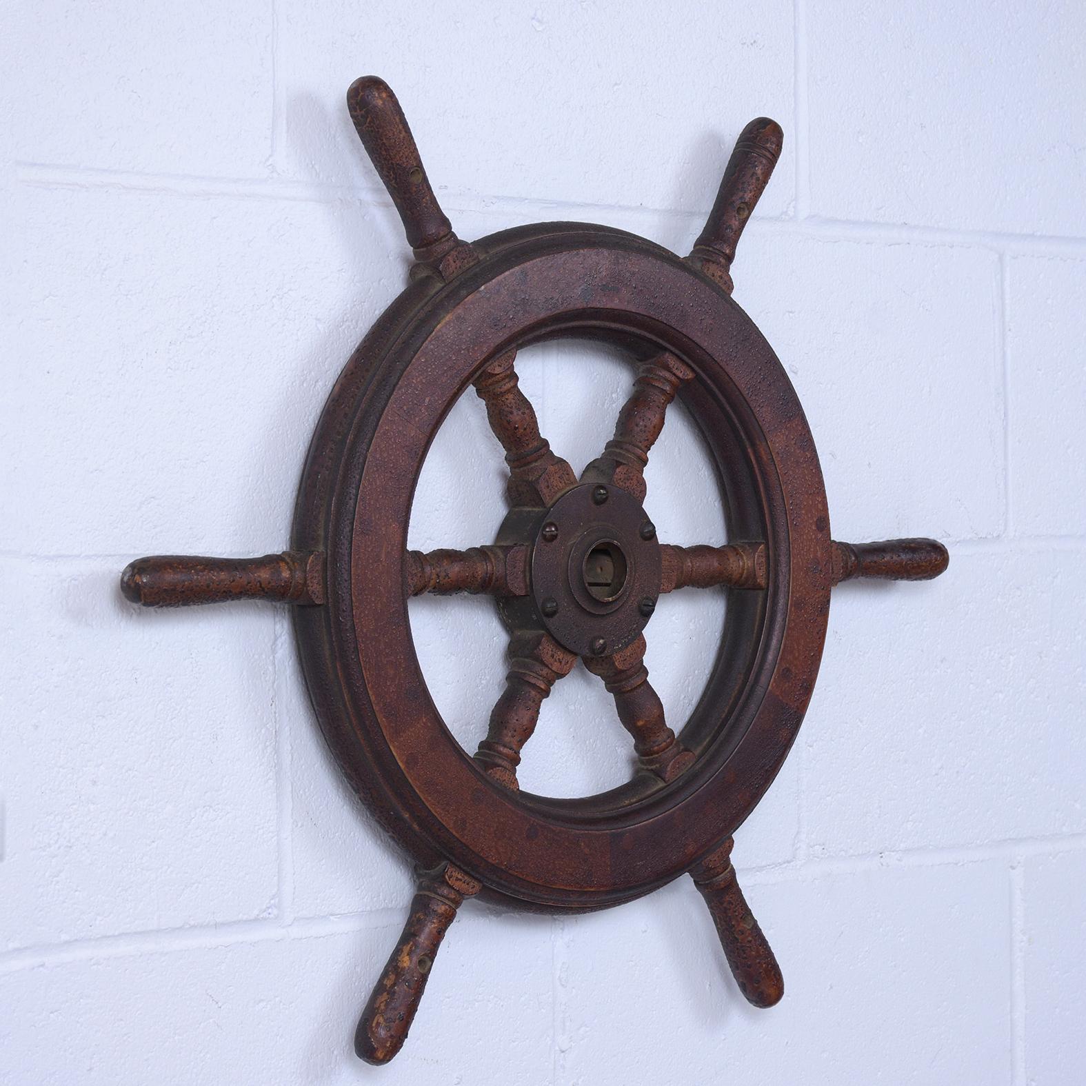 A handcrafted ship wheel is in great condition, comes with six spokes, an iron hub, This eye-catching decorative accent piece is ready to be displayed for years to come.