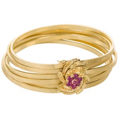 Six Strand 18 Karat Yellow Gold and Ruby Bracelet