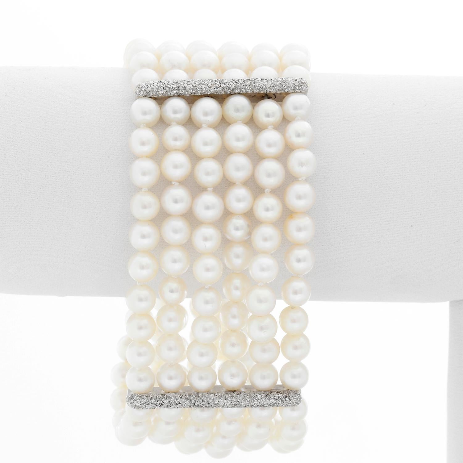 Six Strand Pearl and Diamond Bracelet - Just a little over 7 inches and 1.5 inches wide. The clasp is a beautiful leaf set in diamonds weighing approx 4 cts. This bracelet would make the ideal compliment to a bridal gown, but can also be worn for