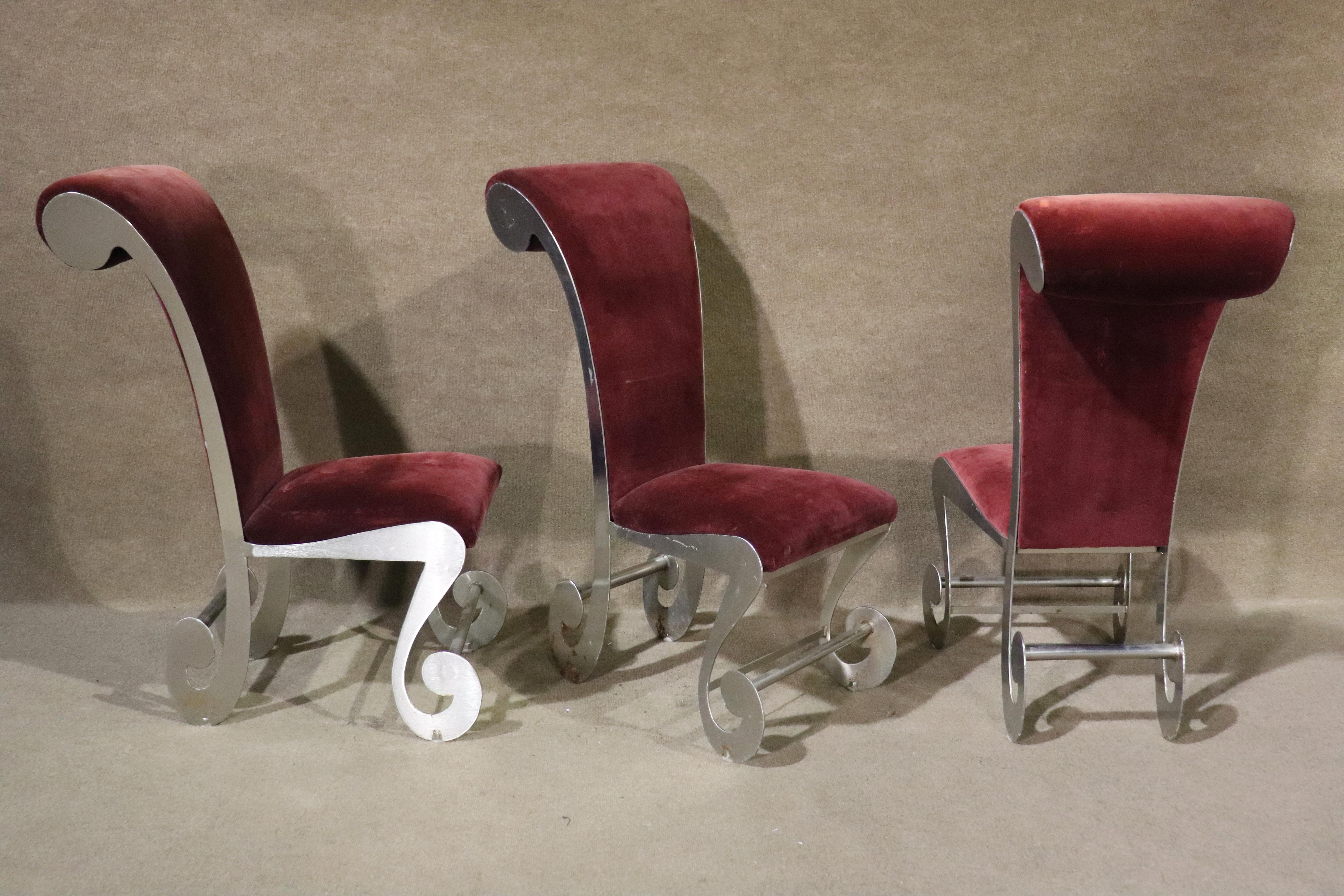 Wild set of six dining chairs with brushed metal frames and velvet seats. Two arm chairs and four side chairs. Fun mad hatter style for your dining room!
Please confirm location NY or NJ
