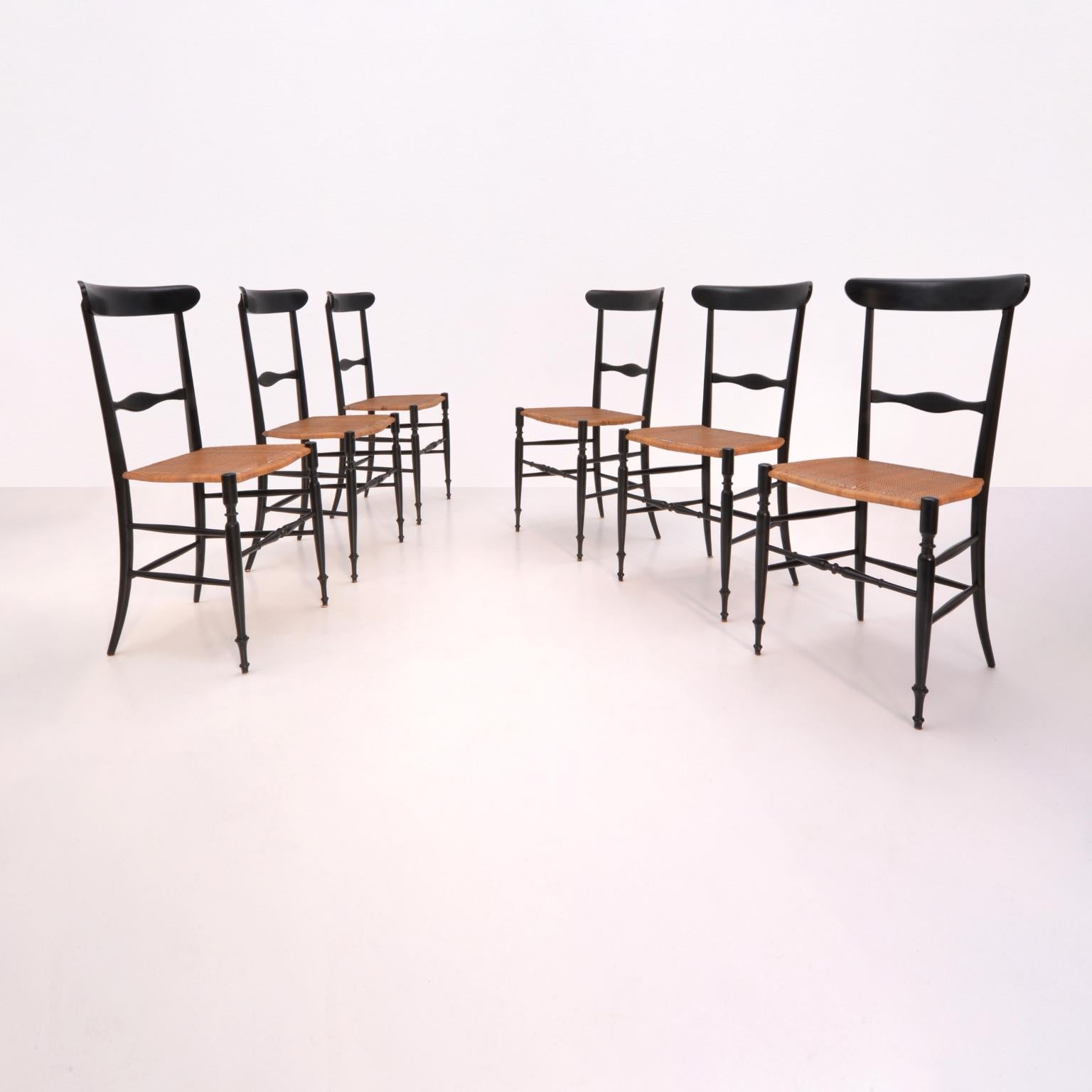 Six super light 'Chiavarina' dining chairs in black lacquered beech, cherry or maple wood with original braided wicker seat. This chair, model 'Campanino' was created by Giuseppe Gaetano Descalzi 'il Campanino' (1767-1855) and manufactured by