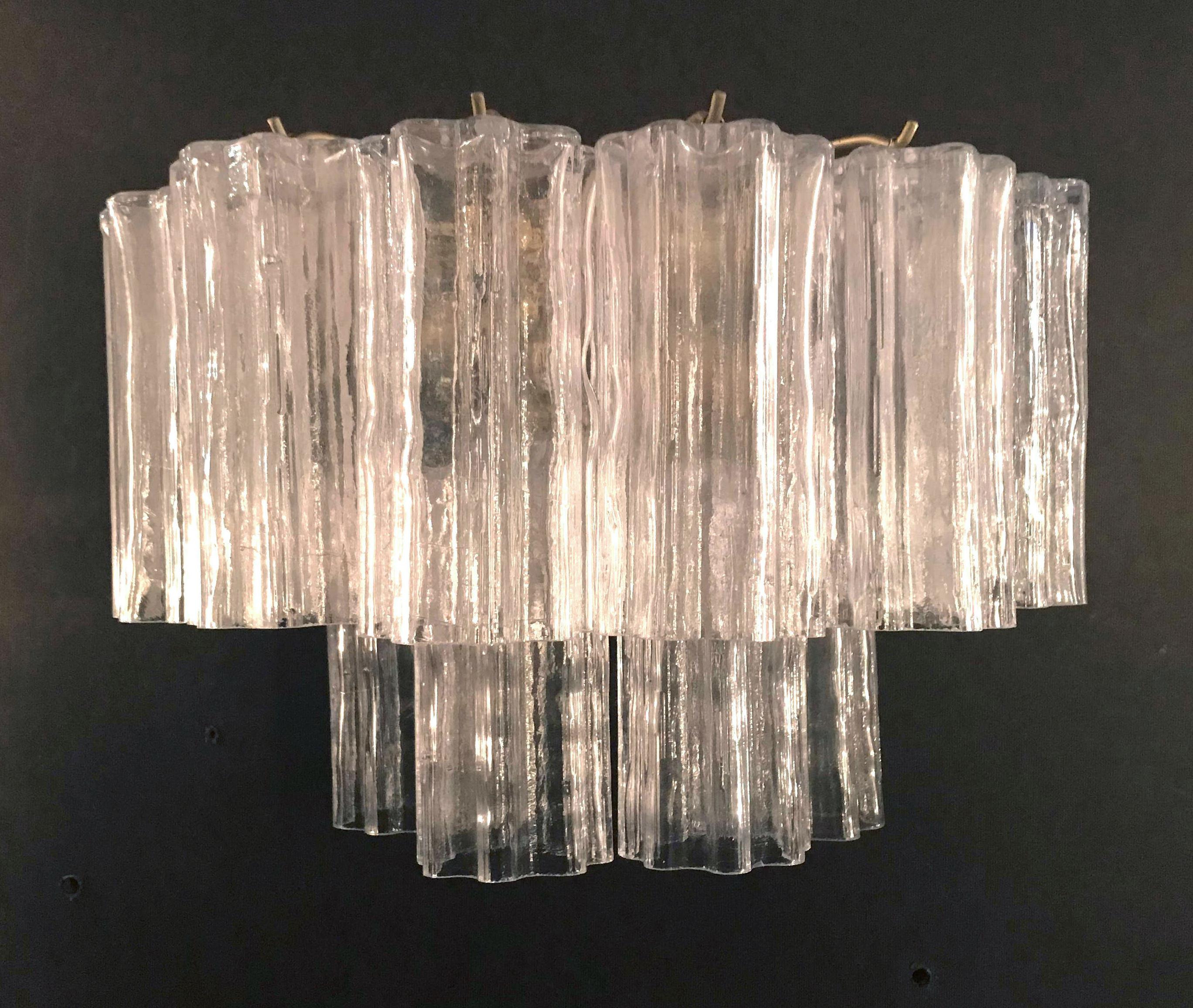 Vintage Italian wall lights with 12 clear Murano glasses blown in Tronchi technique, mounted on antiqued gold metal frames / Designed by Venini, circa 1960s / Made in Italy
2 lights / E26 or E27 type / max 60W each
Measures: Height 11 inches / width