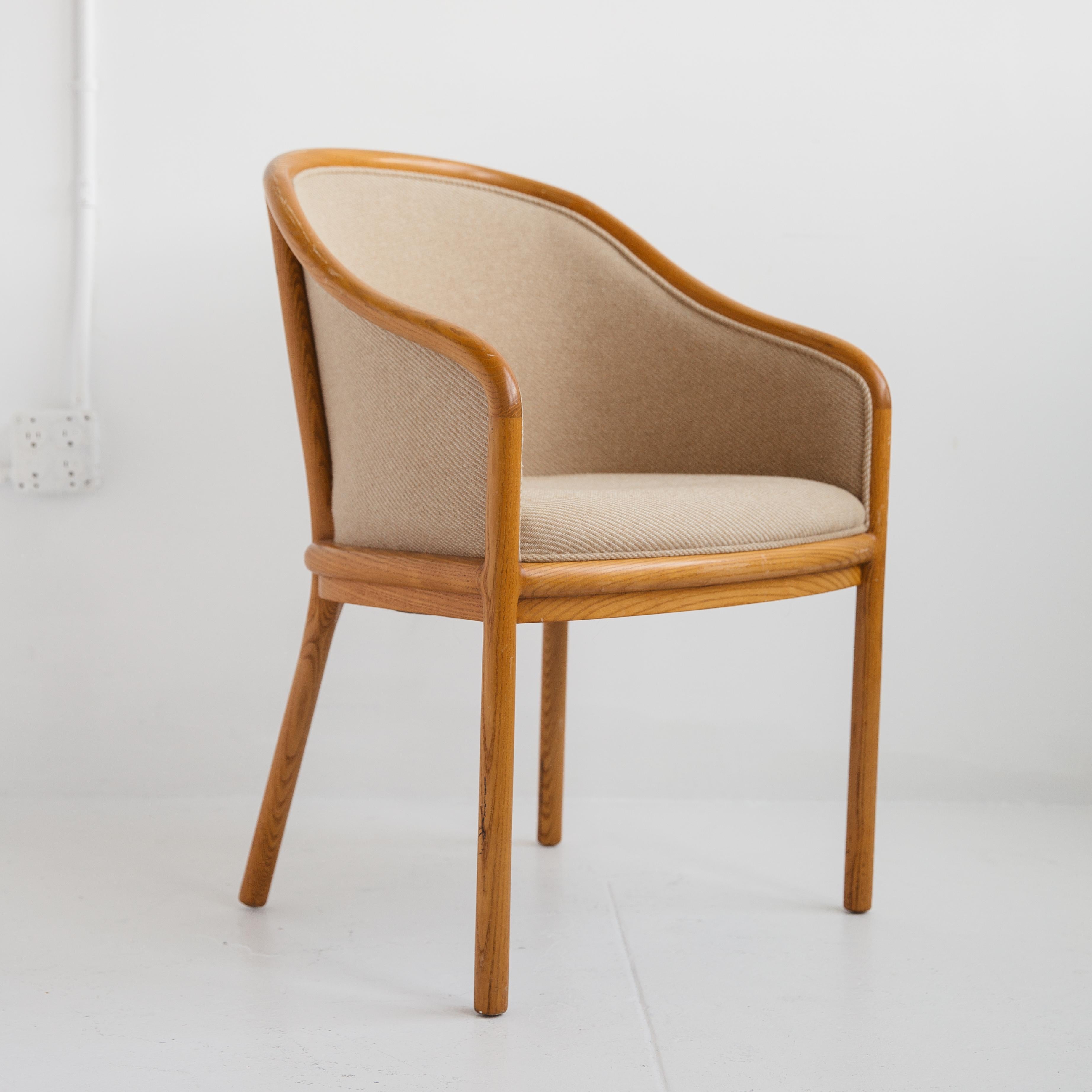 An elegant set of six upholstered dining chairs by Ward Bennett featuring bentwood oak frames and fully upholstered seats and backs in a textured taupe fabric. This is American Mid-Century Modern design at its best. The bend of the arm references