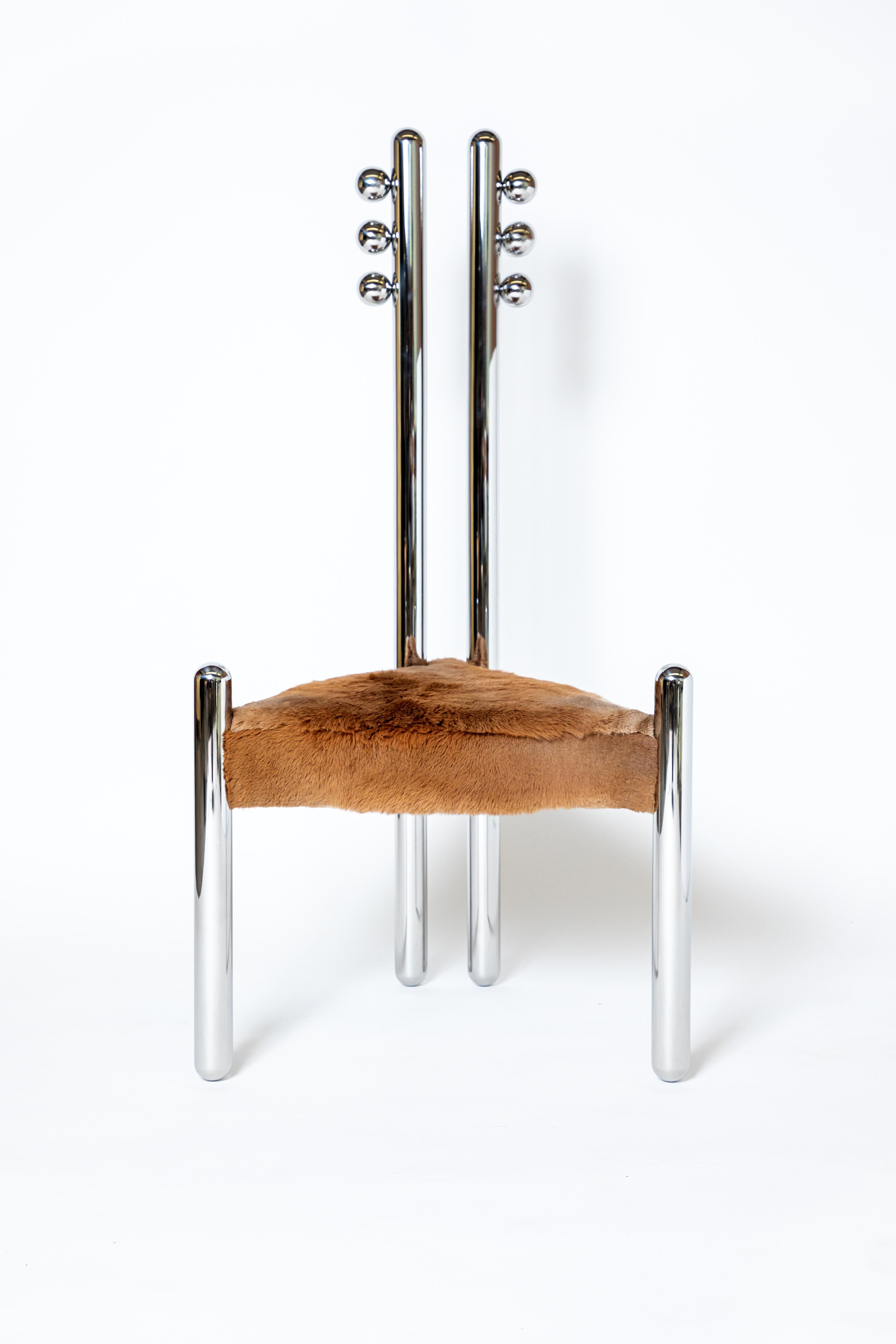 Six variations on stainless steel by Pietro Franceschini
Two pipes back
Dimensions: W 51 x L 61 x H 123 cm 
Materials: Stainless steel mirror-polished, sheepskin

Series of six chairs in stainless steel and fur designed by Pietro Franceschini.