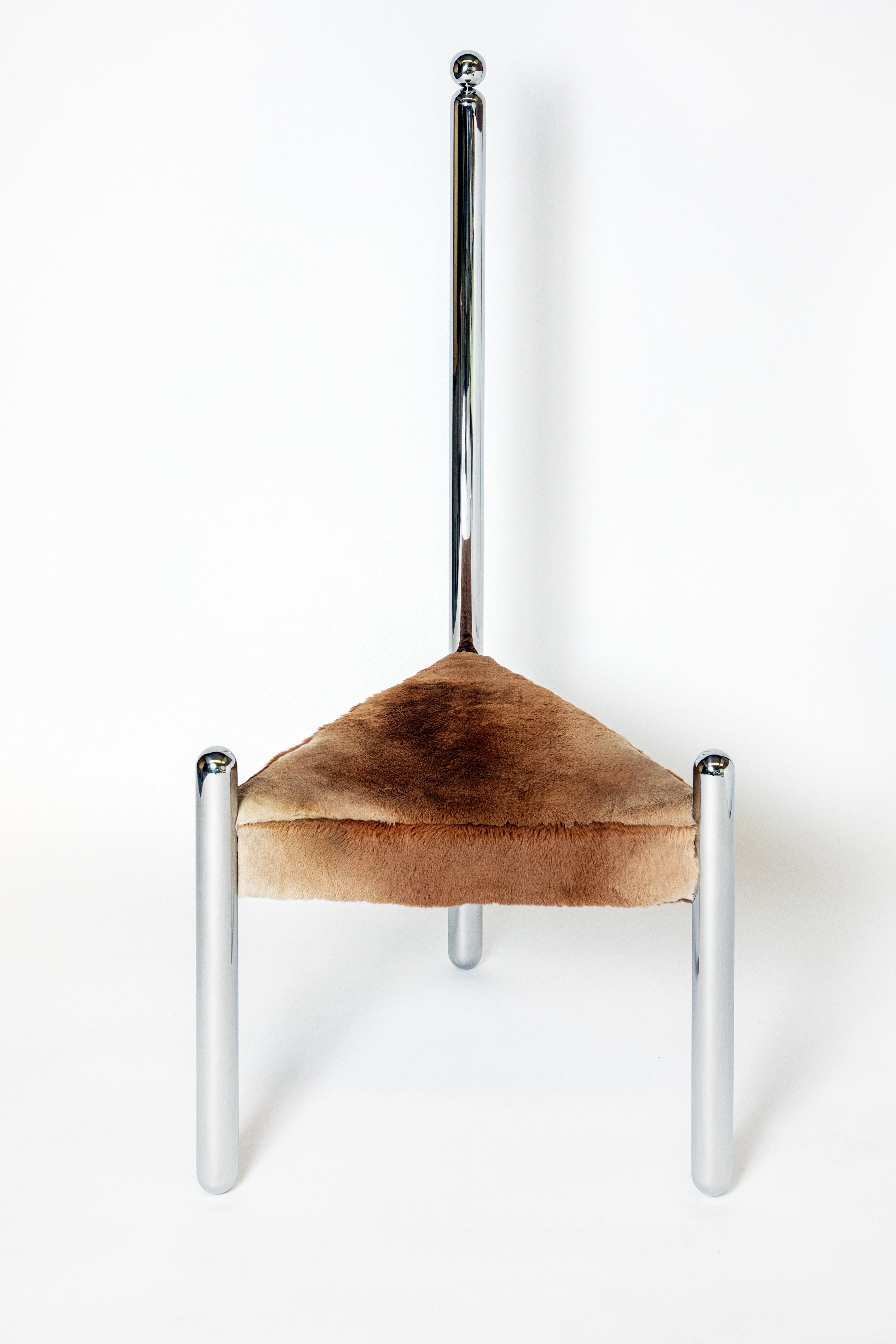 Six variations on stainless steel by Pietro Franceschini
Single pipe back
Dimensions: W 51 x L 61 x H 123 cm 
Materials: Stainless steel, mirror-polished, sheepskin

Series of six chairs in stainless steel and fur designed by Pietro