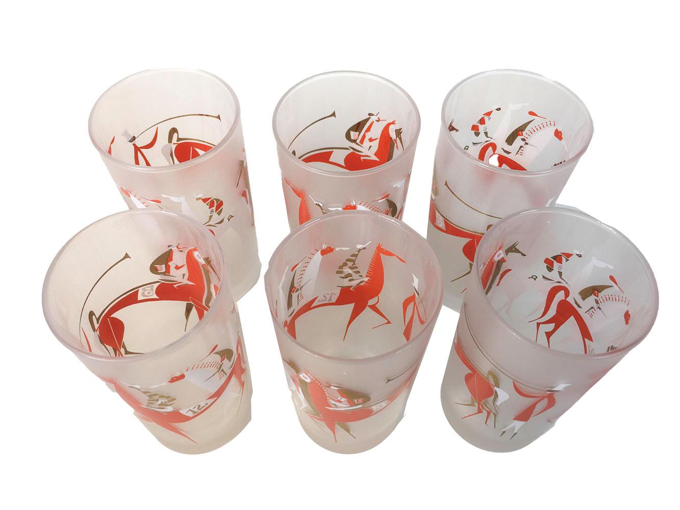 Very hard to find, midcentury highball glasses with stylized Atomic period horse race design of horses and jockeys in red, white and black enamel with gold applied to a frosted ground. All in excellent condition.