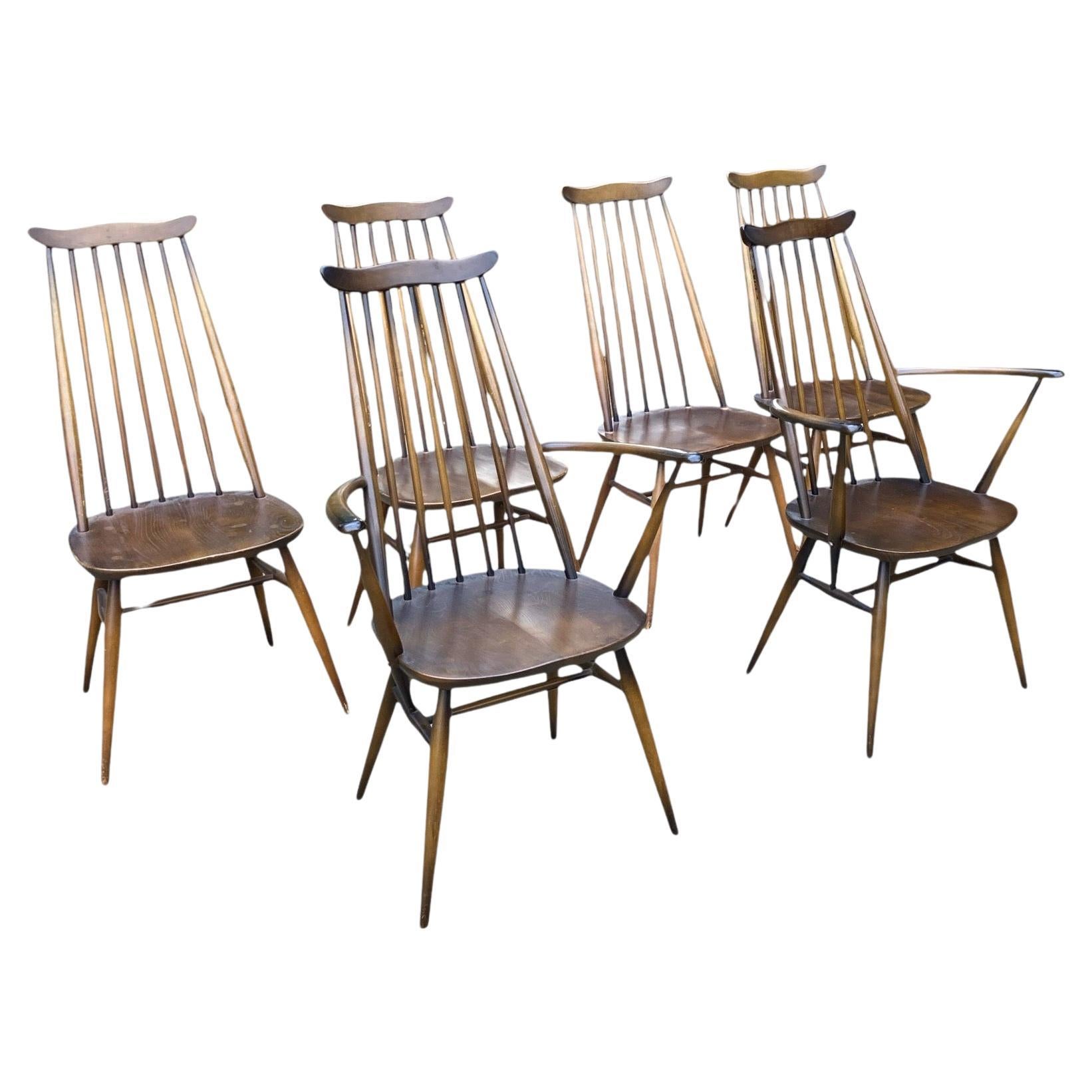 Six chaises vintage Ercol stick windsor back chairs avec deux fauteuils