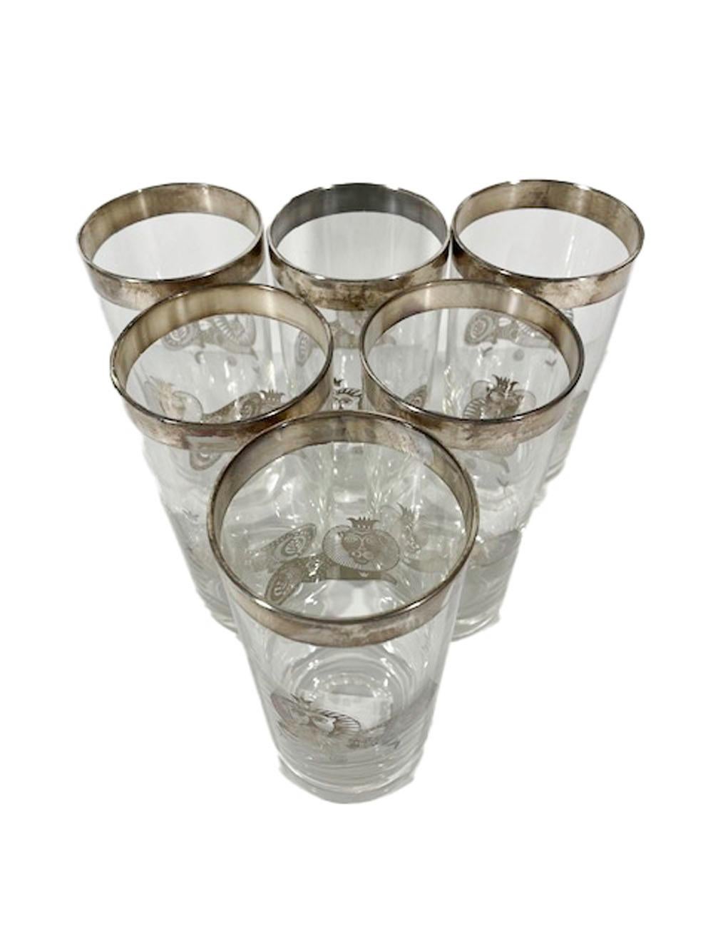 Signed set of 6 Georges Briard highball glasses with a silver rim above stylized images of recumbent lions wearing crowns.
