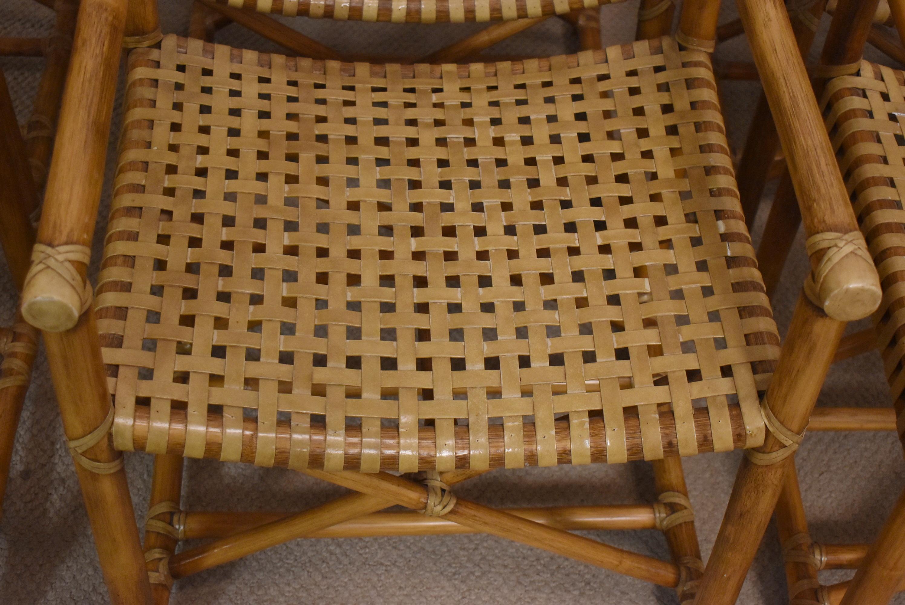 Six very nice bamboo & rawhide Antalya chairs by McGuire. Woven seats and backs.