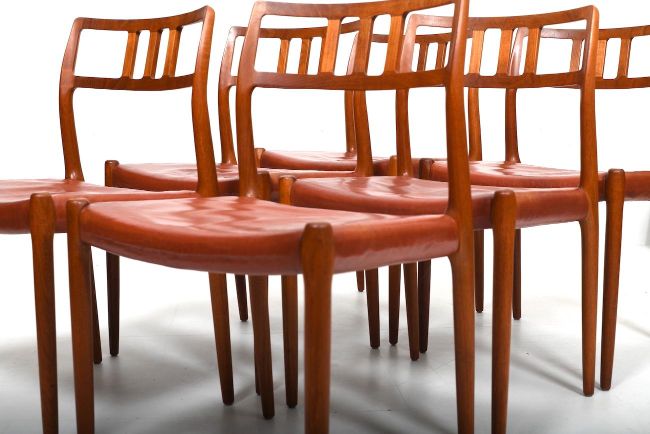 Six vintage Niels O. Møller Teak and Indian Red Leather Chairs For Sale 4