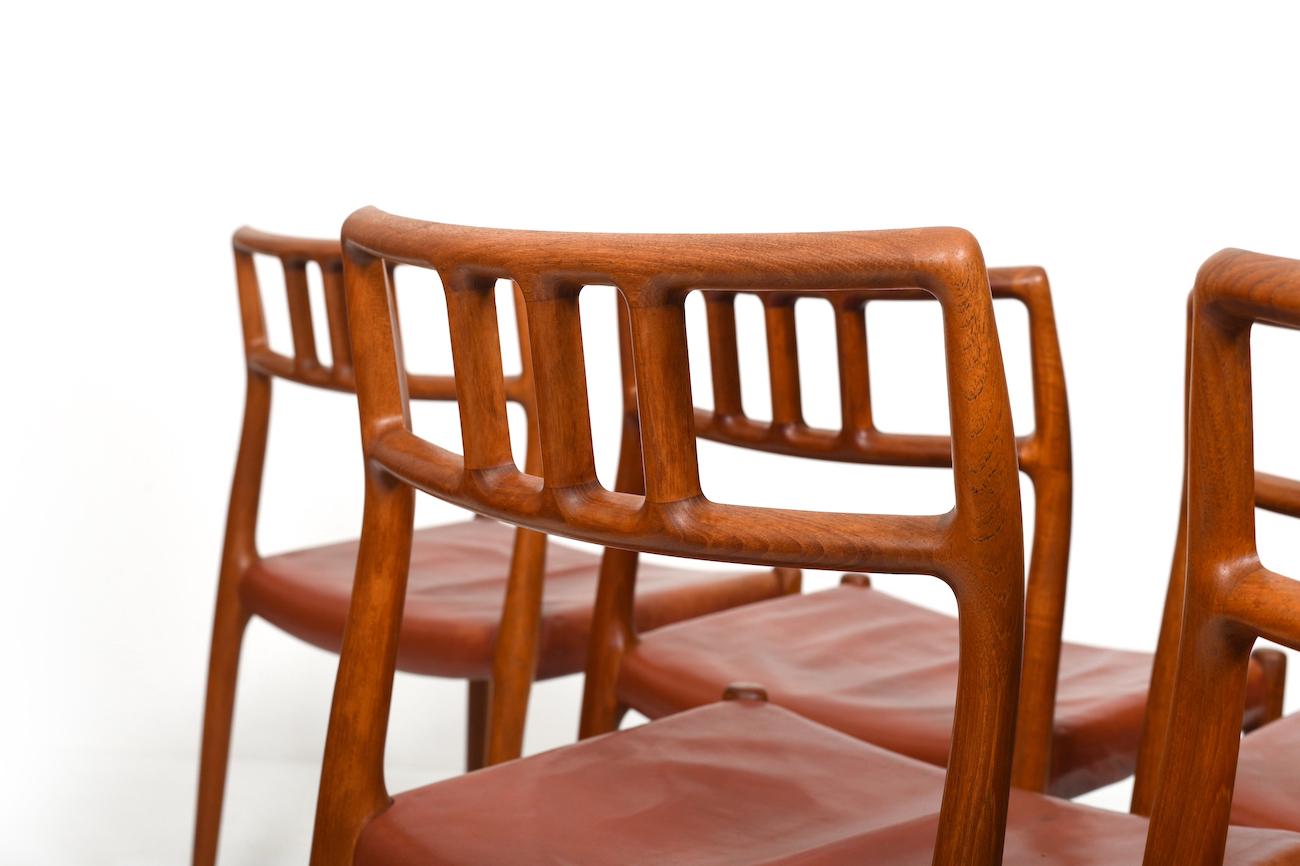Six vintage Niels O. Møller Teak and Indian Red Leather Chairs For Sale 1