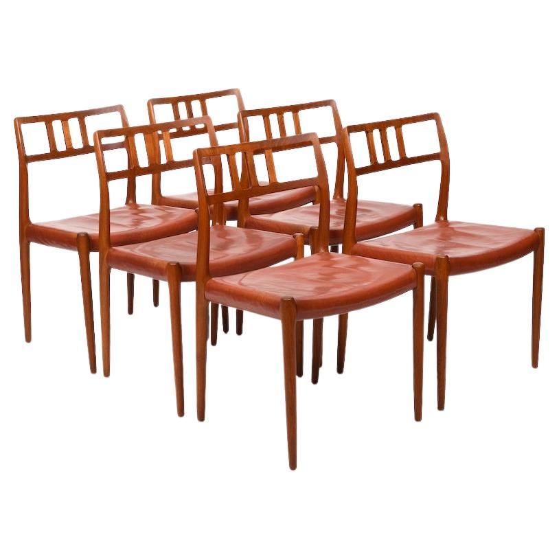 Six vintage Niels O. Møller Teak and Indian Red Leather Chairs For Sale