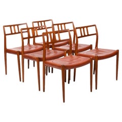 Six chaises vintage Niels O. Møller en teck et cuir rouge indien