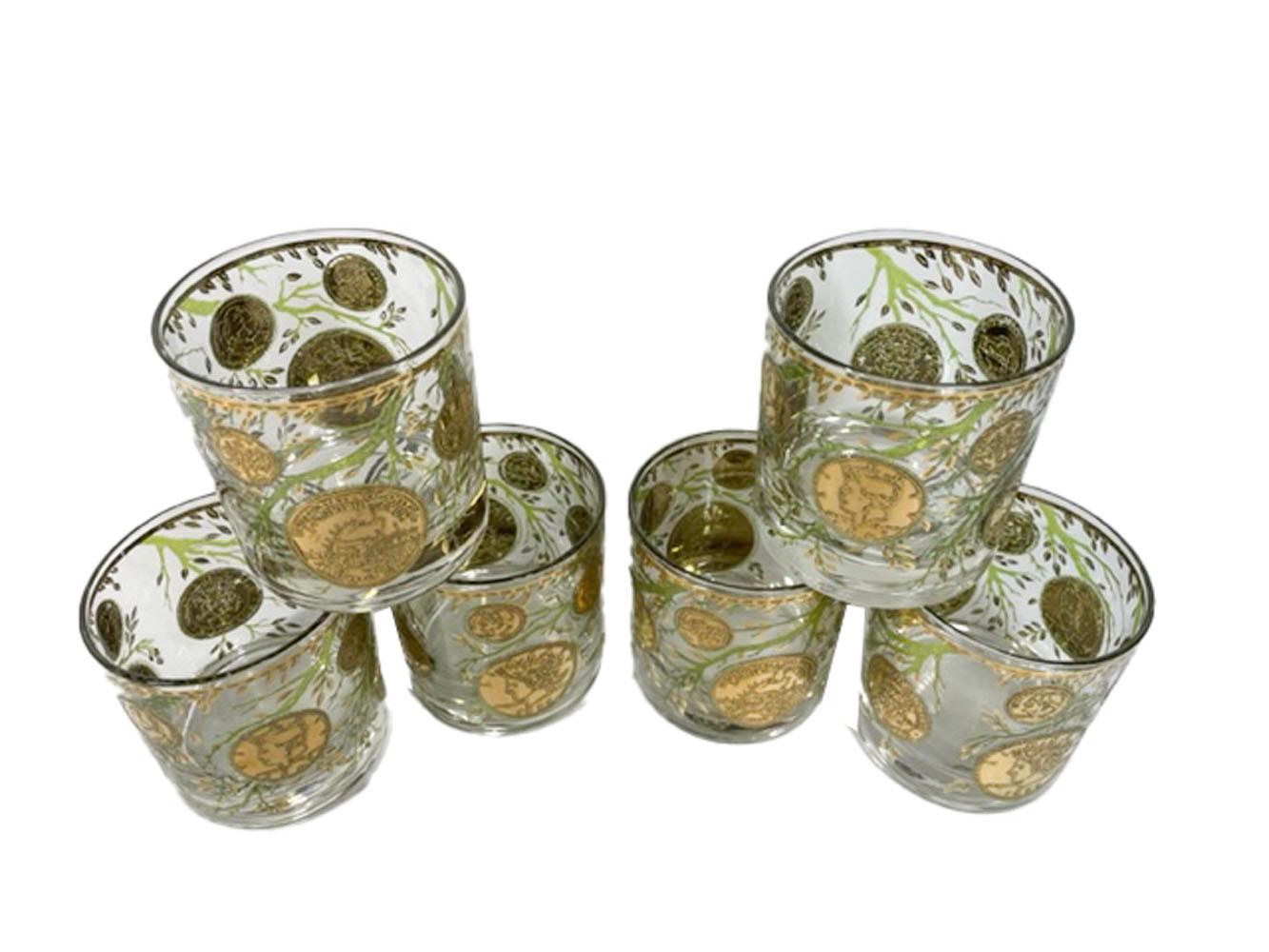 Sic vintage rocks glasses by Culver, LTD in the 'Midas' pattern (gold). Decorated with American coins in 22 karat gold on branches of raised translucent green enamel with gold leaves.