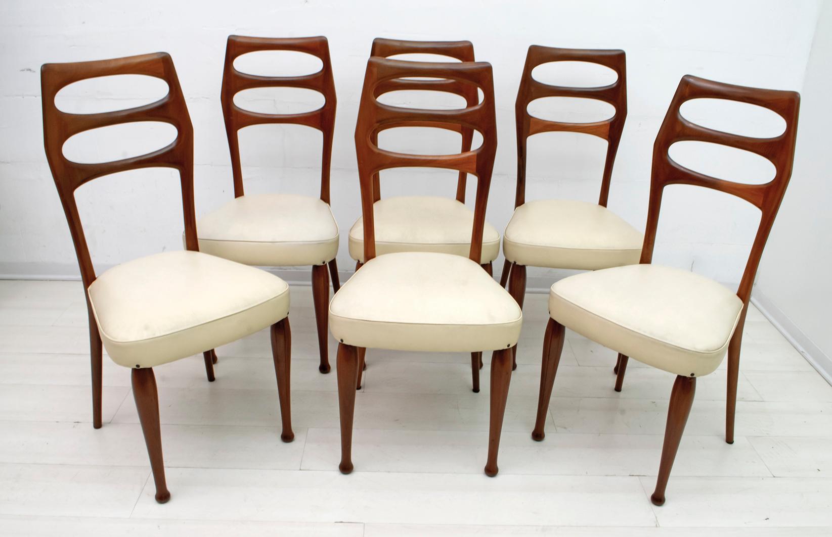 Six dining chairs designed by the famous Italian architect Vittorio Dassi, solid mahogany chairs and original eco-leather upholstery, in excellent condition.