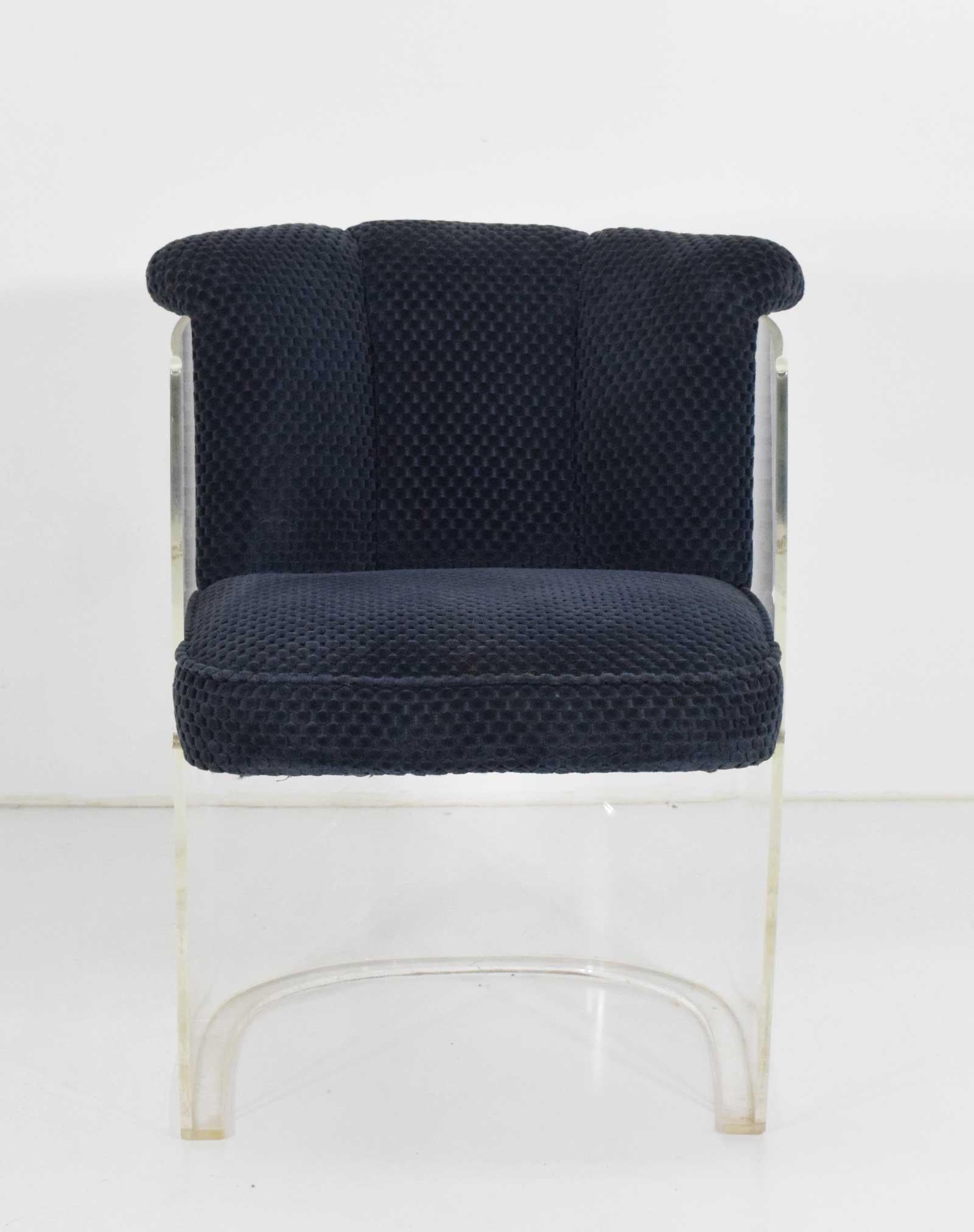 This is the 6550 Cycle III dining chair by Vladimir Kagan. First introduced in 1967 and currently in production. Chairs feature a barrel Lucite frame that is one piece, seat cushion floats with a Lucite bar under the front side of the seat for