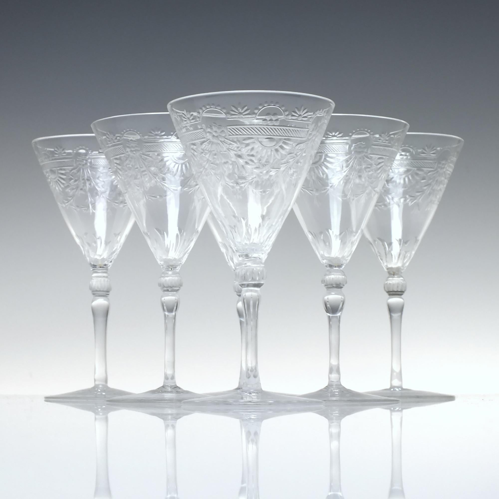 Technical Description

A stunning set of six Web Port or Sherry Glasses. They have conical bowls with intaglio cut floral swags above delicate stems and cut conical feet.

Stunning examples.

Date & Origin 

England, 1936-49.