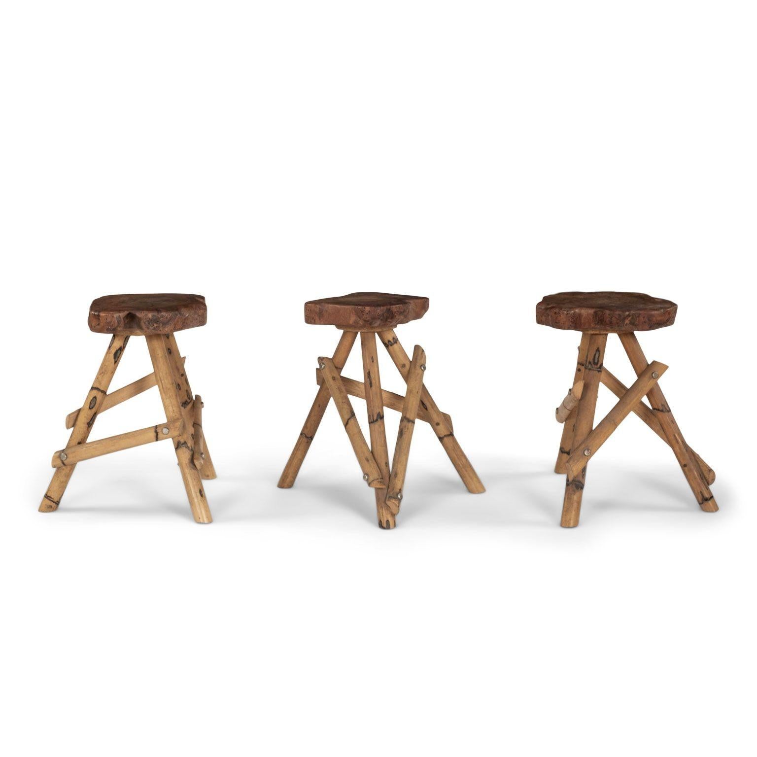 Six tabourets tripodes en bambou. Sièges en bois d'olivier. Vendus ensemble au prix de 4 800 $ pour l'ensemble.