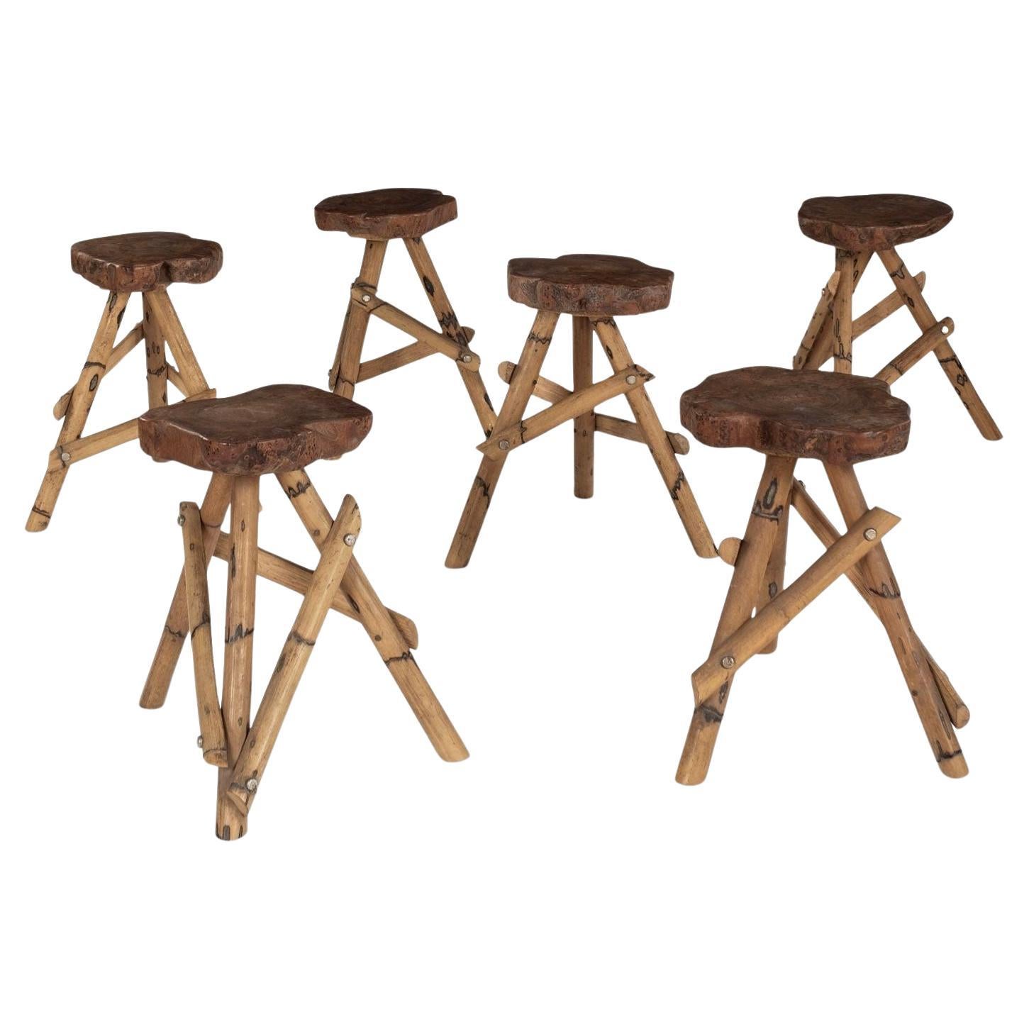 Six tabourets à base tripode en bois et bambou en vente