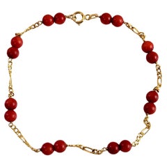 Sixteen Coral Red Bead Women Bracelet in 14k Yellow Gold