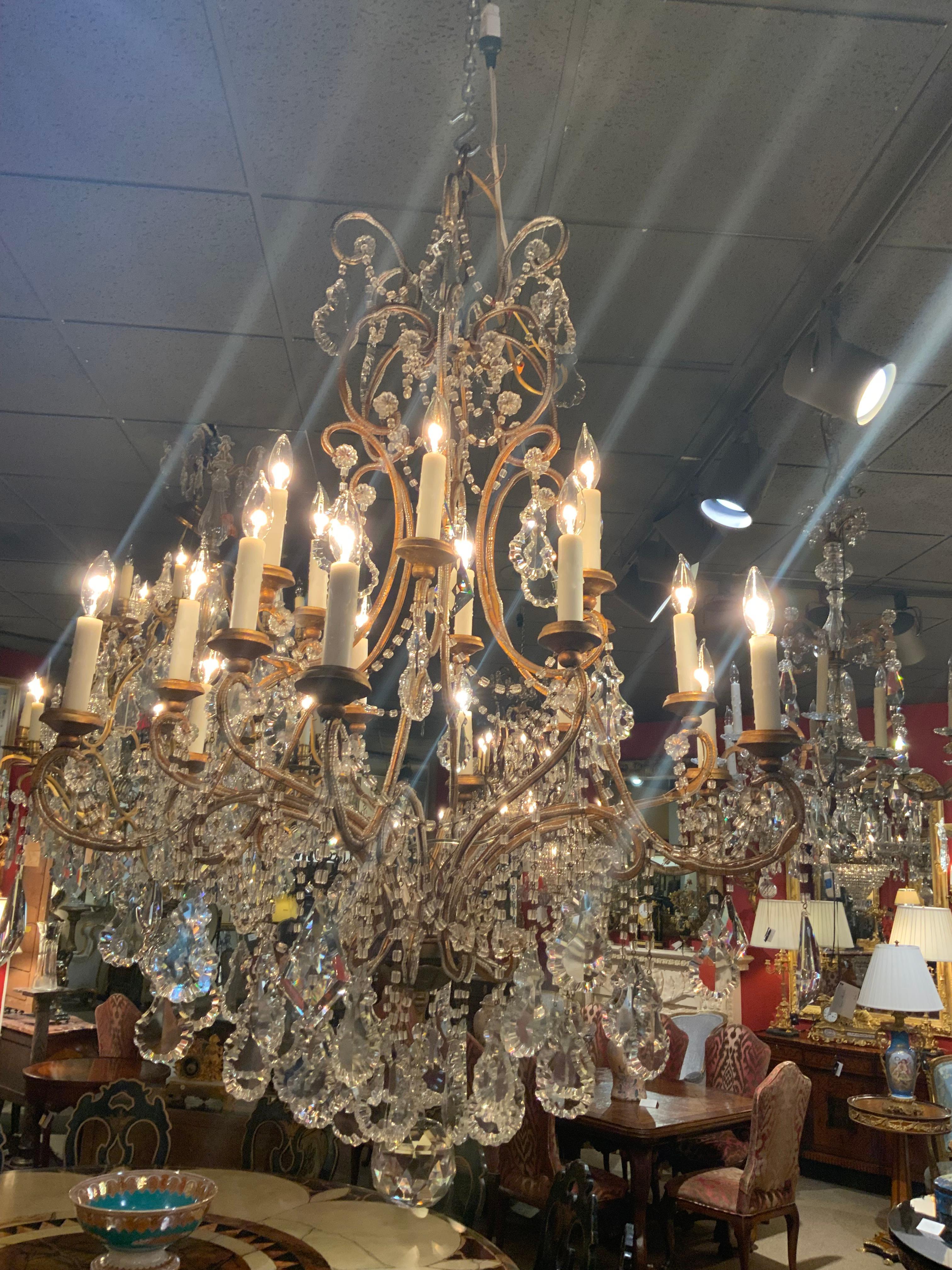 Sixteen light beaded and gilt metal chandelier  In Excellent Condition For Sale In Houston, TX