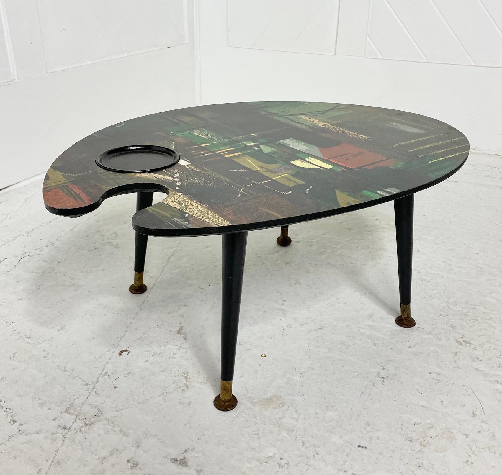 Sixties palette table
Screen printed on a laminate top
After a textile design by John Piper
Circa 1960

This rare palette table has a screen printed top from the textile design 'Stones of Bath' by John Piper for the 1960 Sanderson & Co centenary