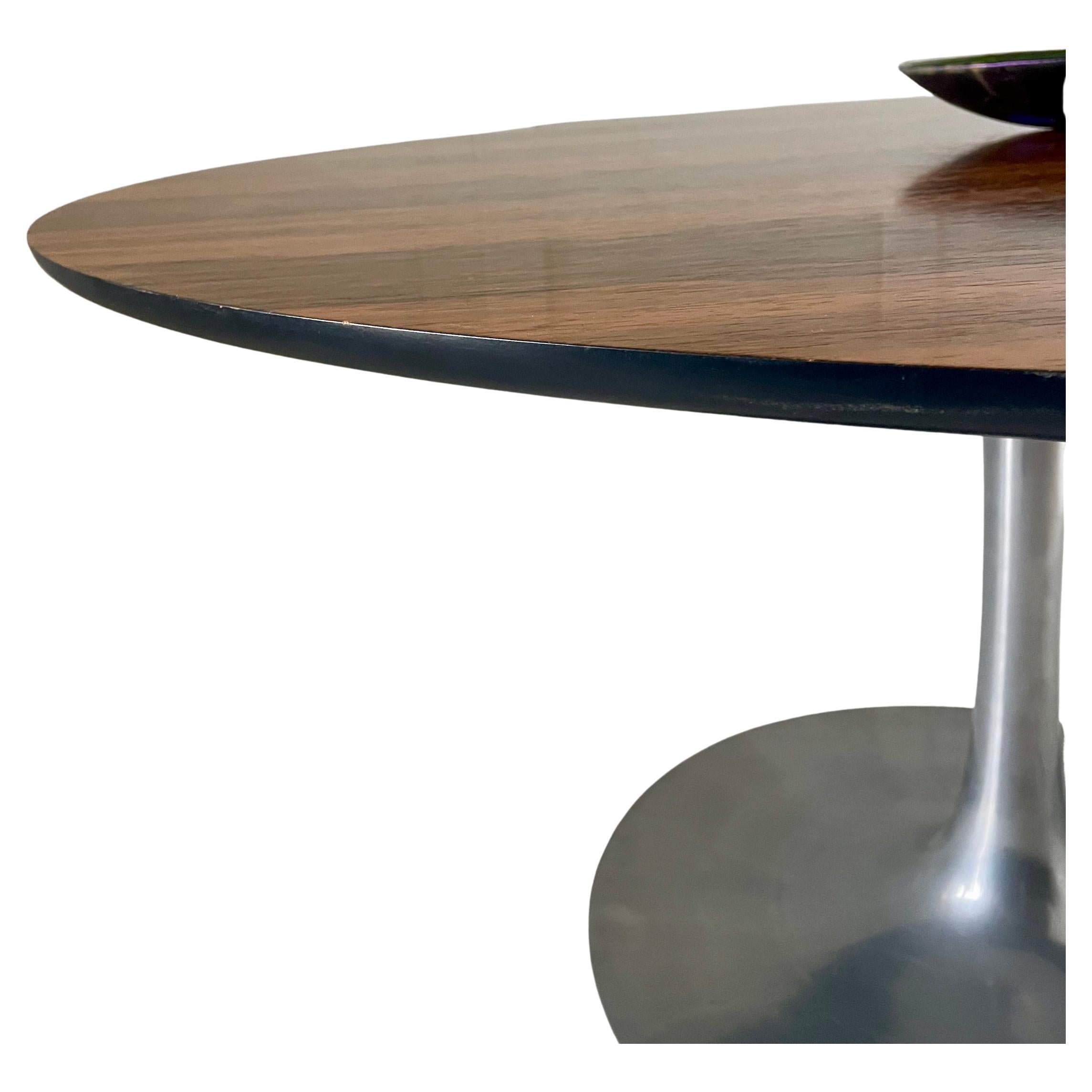 Circular ‘Tulip’ design rosewood table with polished aluminium base

Designed by Maurice Burke 

For Akana

Height 73cm.  Diameter 135cm

Maurice Burke (1921-2013) was an entrepreneur and furniture designer of the mid-20th century, best known for
