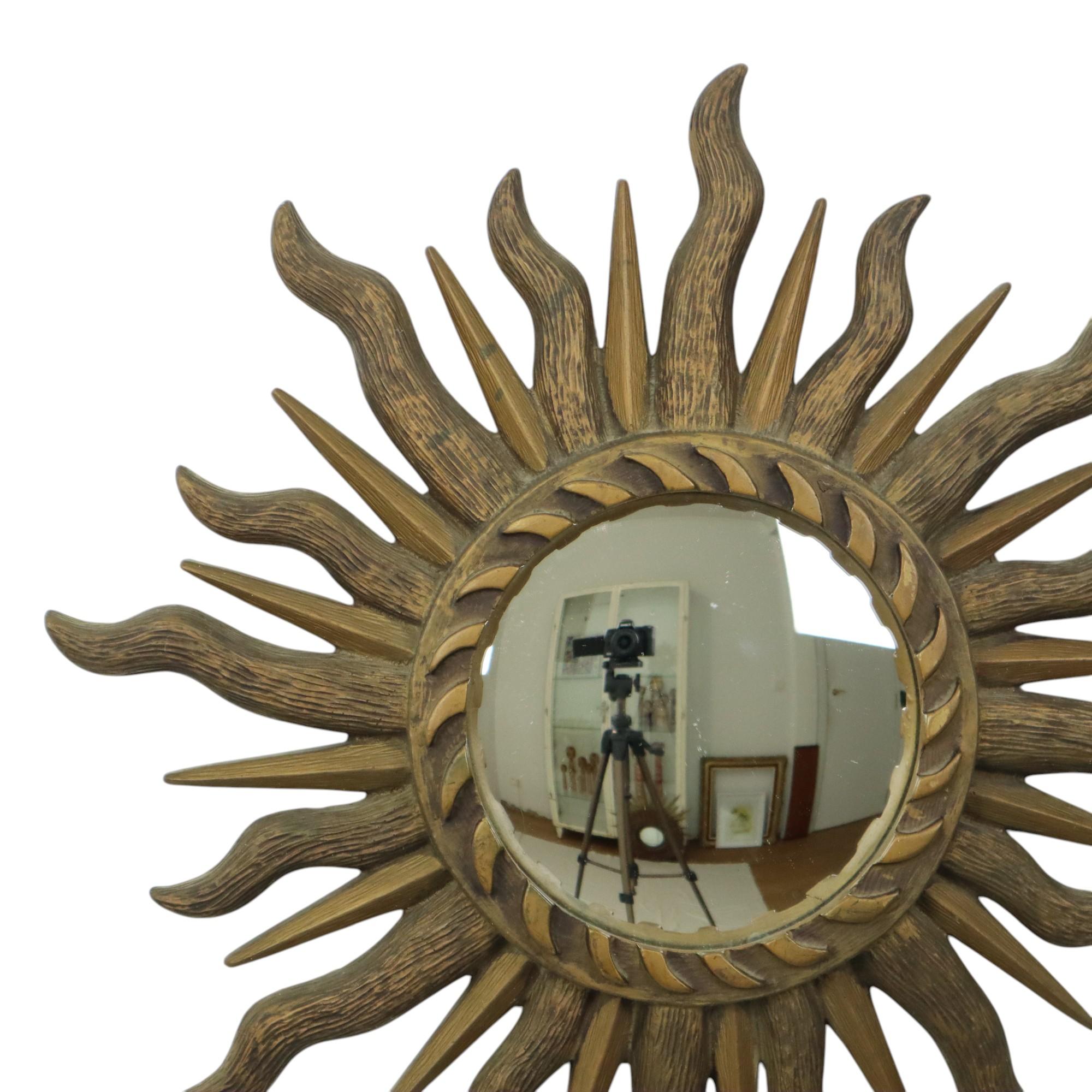 Vintage dark gold sunburst mirror, sun mirror with convex glass, also called butler mirror, synthetic resin frame (resin), mid century modern eye-catcher from the 60s.

These mirrors are becoming increasingly rare, authentic and timeless collector's