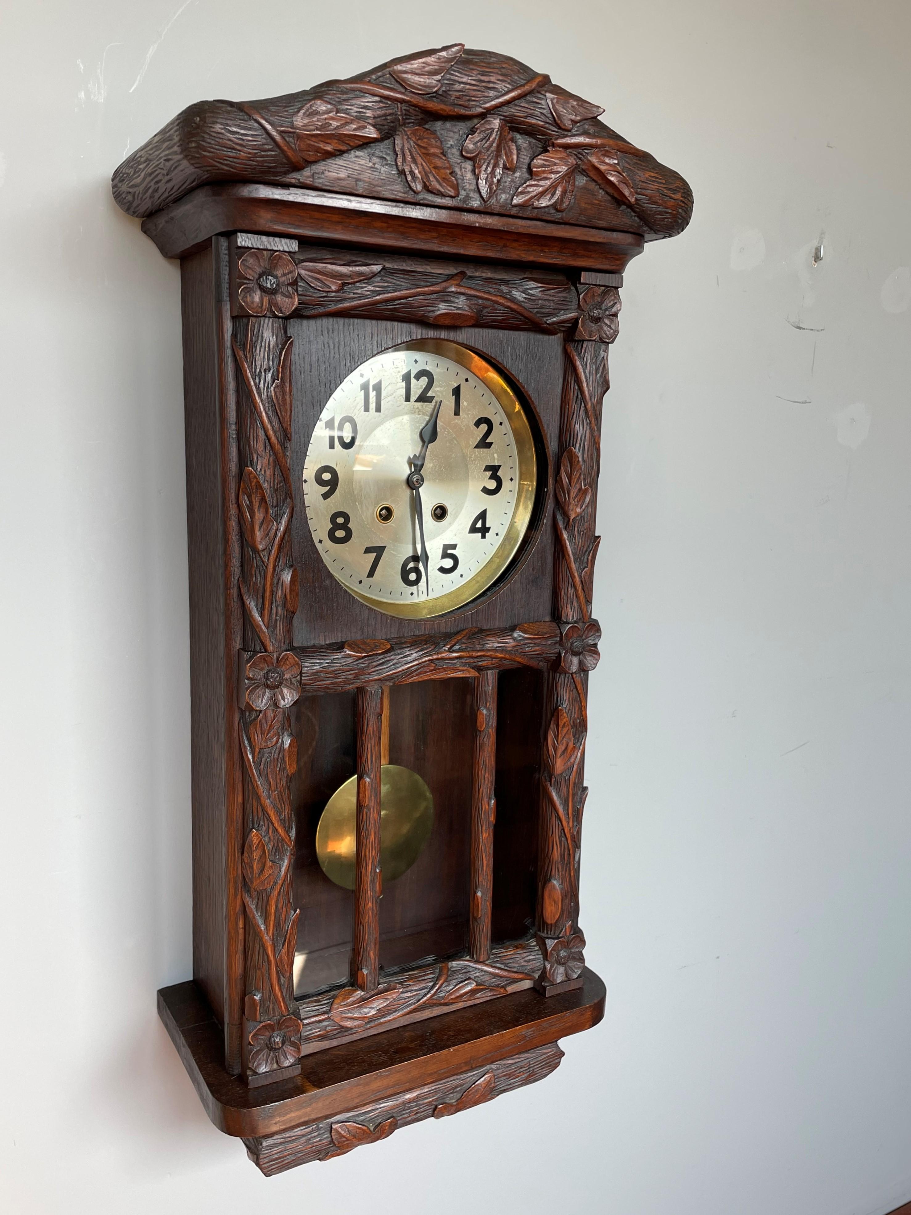 Fine quality, hand carved antique oak wall clock.

This beautiful black Forest wall clock from the earliest years of the twentieth century is entirely and skillfully hand carved out of solid and very thick oak. This makes it one of the heaviest