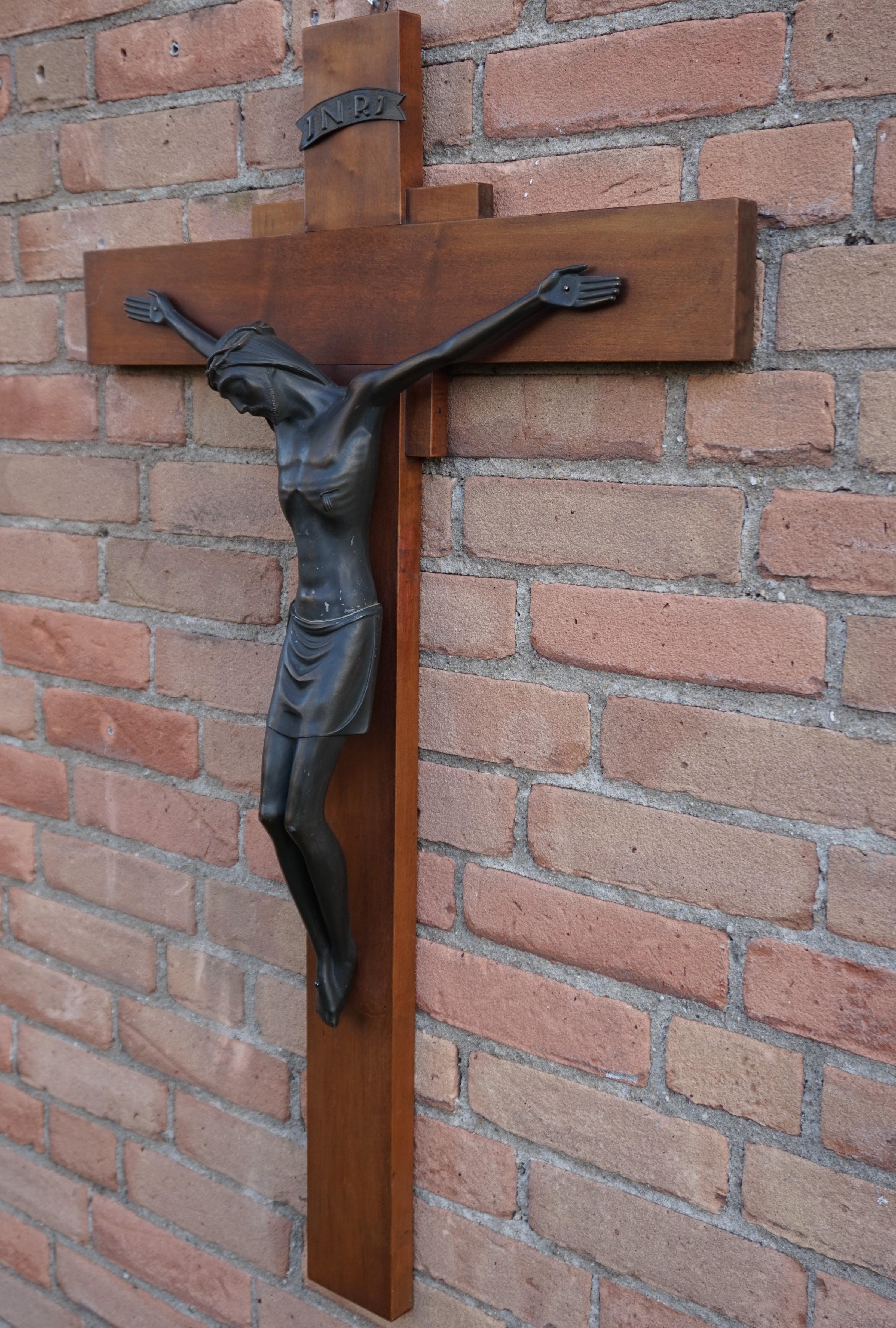 Good size and meaningful work of religious art.

This handcrafted, Christian work of art dates from the 1930s. Over the centuries wall crucifixes have been made in all kinds of shapes and sizes, but the ones from the Art Deco Era are the most