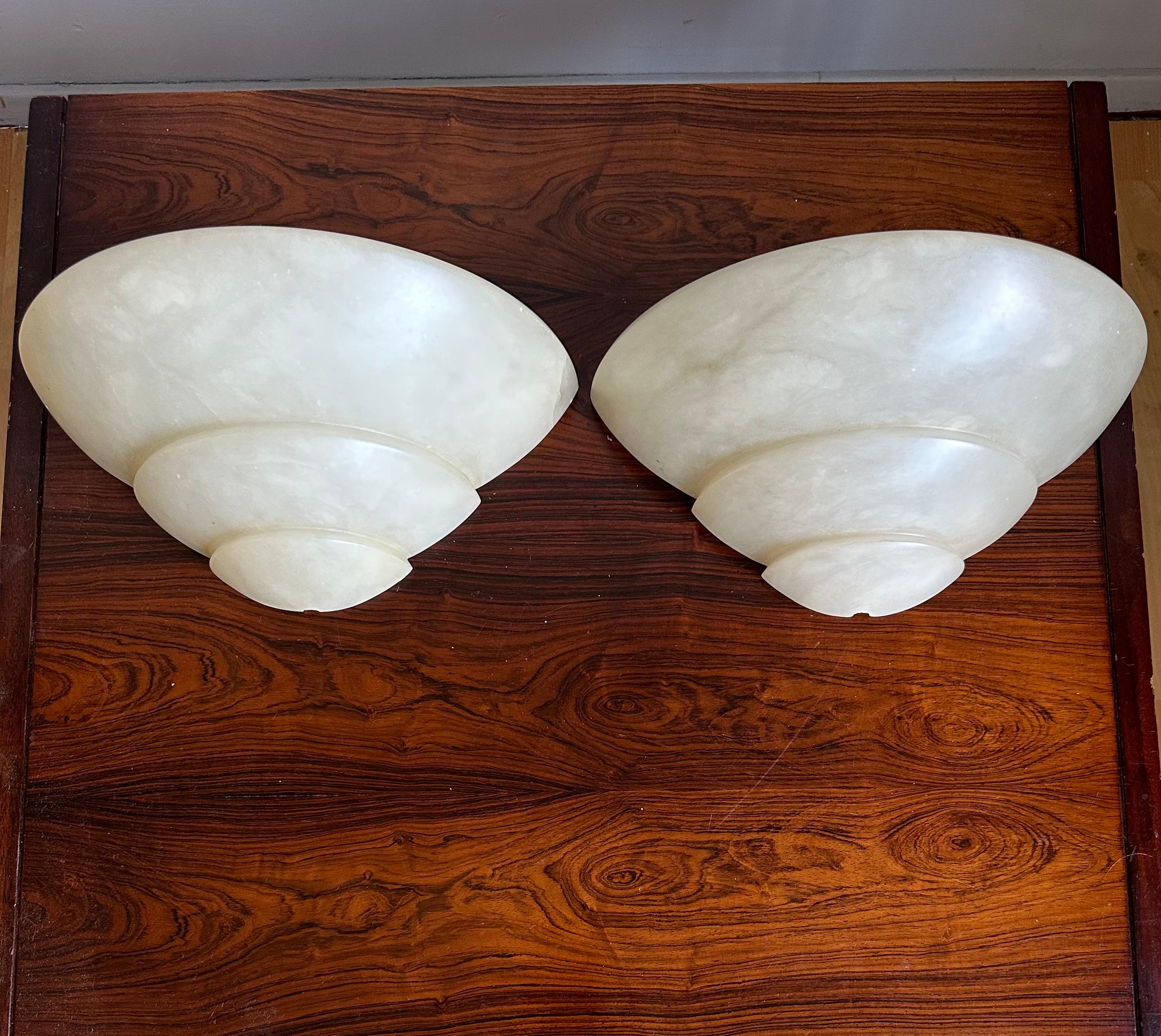 Wonderful design and easy to mount set of two alabaster wall sconces.

If you are looking for a stylish and timeless way to bring light into your entry hall, bathroom, kitchen or bedroom or if you are looking for the perfect wall lights over your