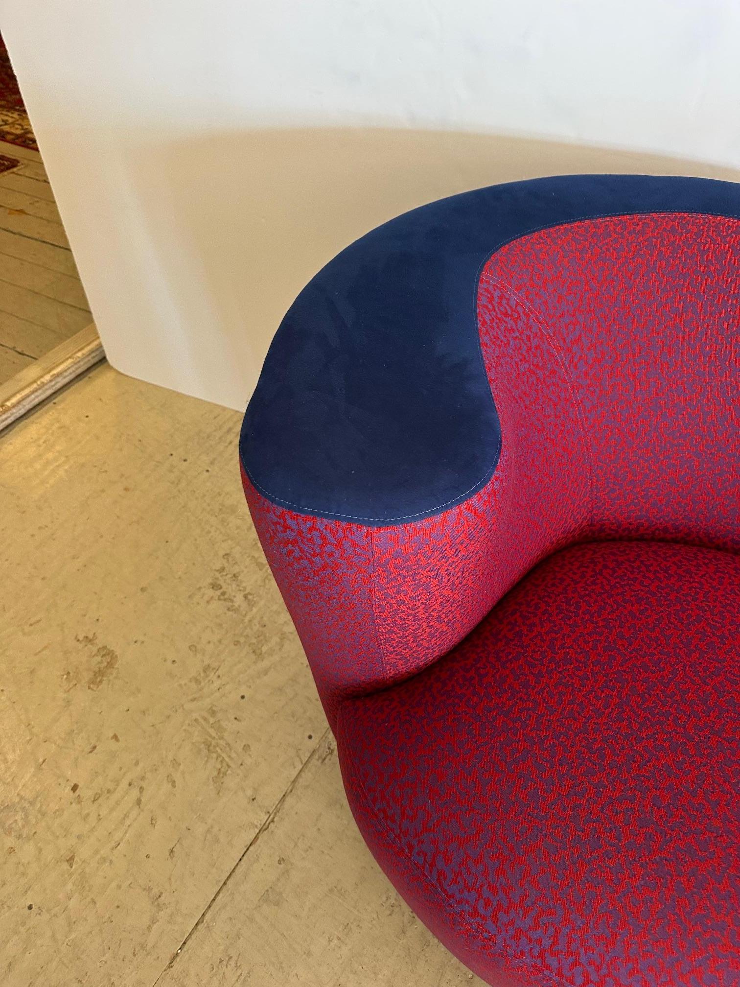 Eye popping chic pair of nautilus shaped upholstered swivel club chairs having a sizzling hot combo of ultra suede and abstract pattern fabric.
Seat depth 21”