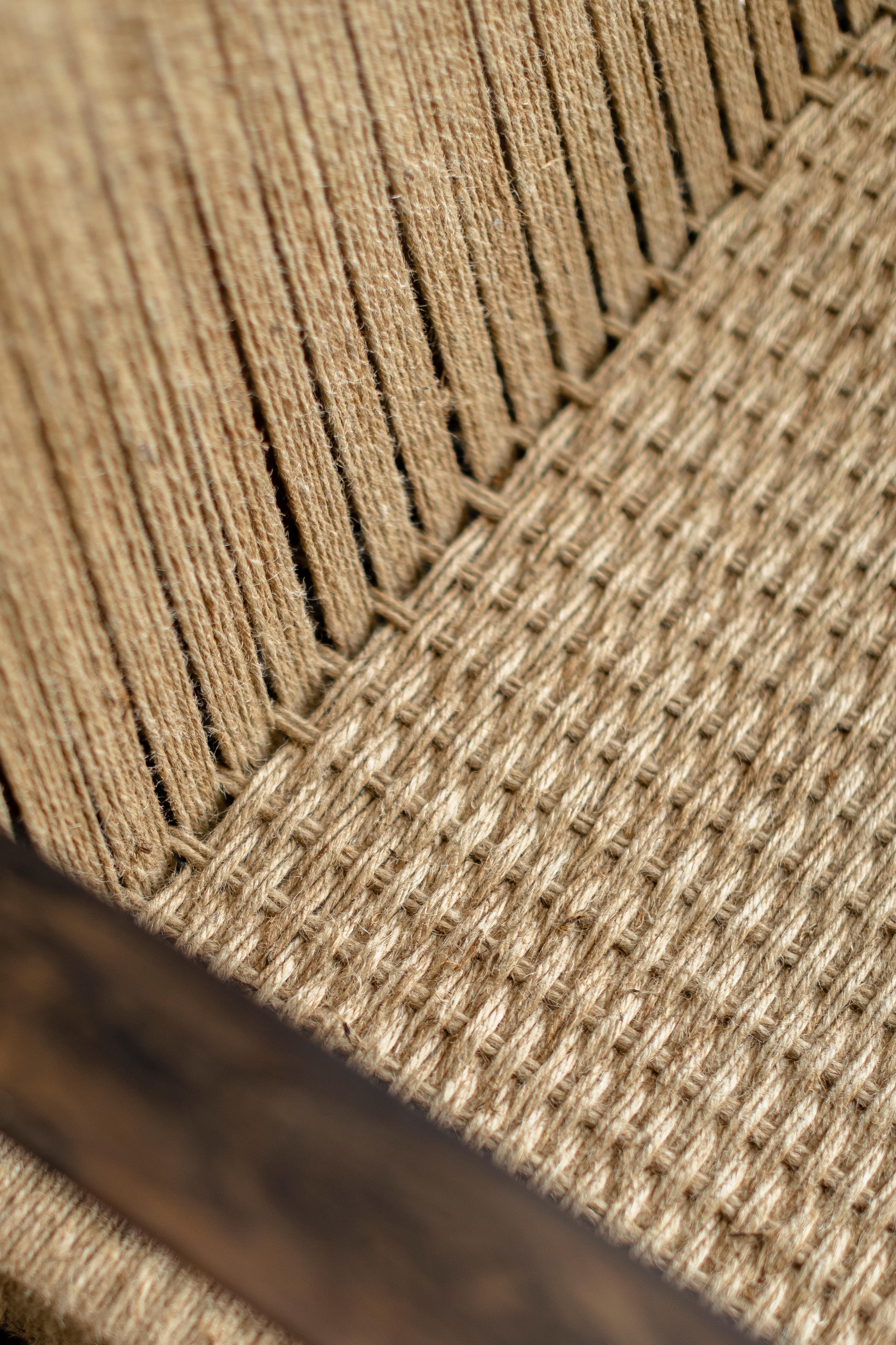 SK Collection wooden lounge chair with armrest, made from oak or tzalam wood and handwoven with papercord, jute or piola.