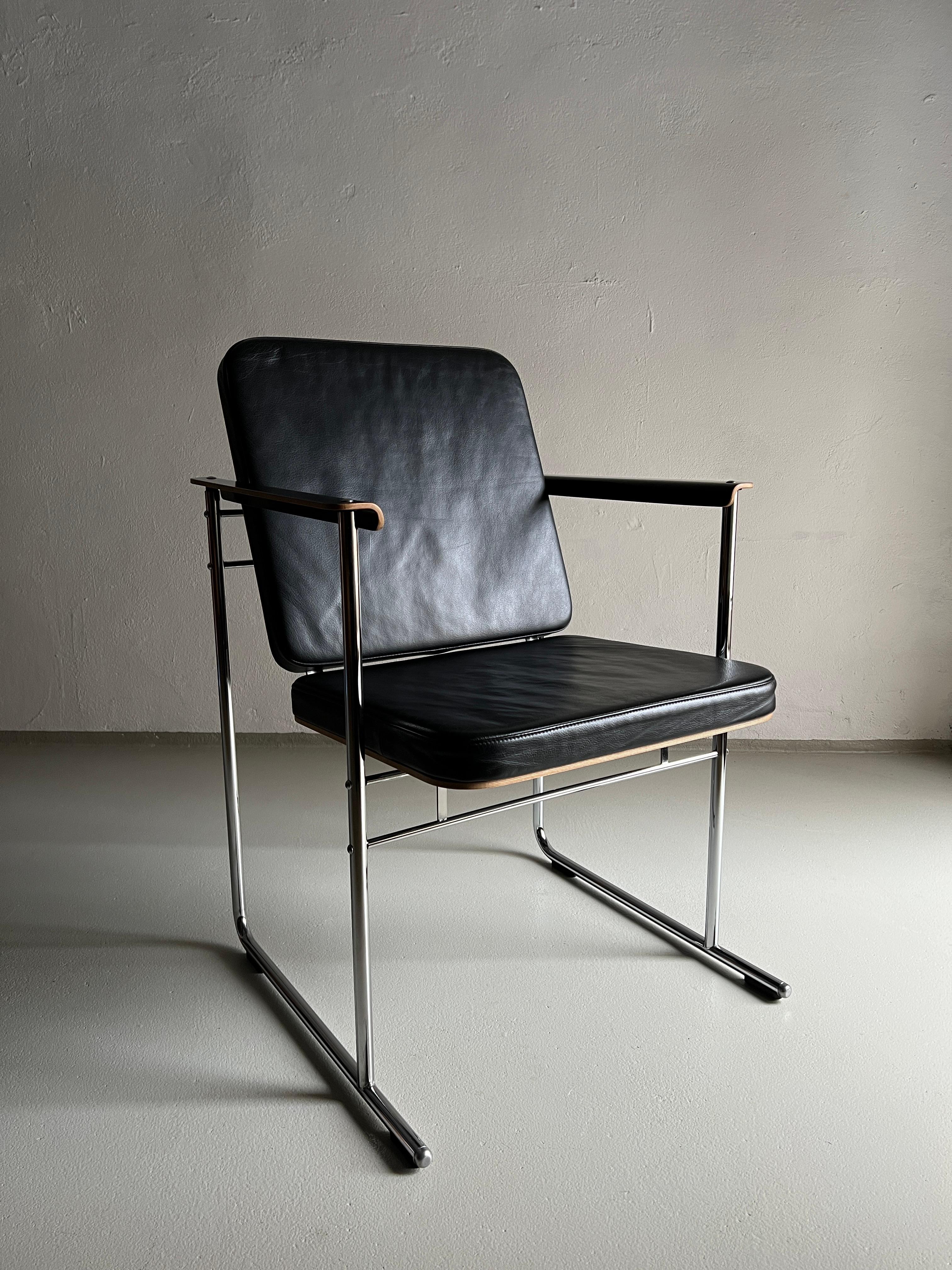 Set of 4 “Skaala” armchairs designed by Yrjö Kukkapuro for Avarte. Laminated birch, chrome-plated tubular steel frame, high-quality black leather upholstery.