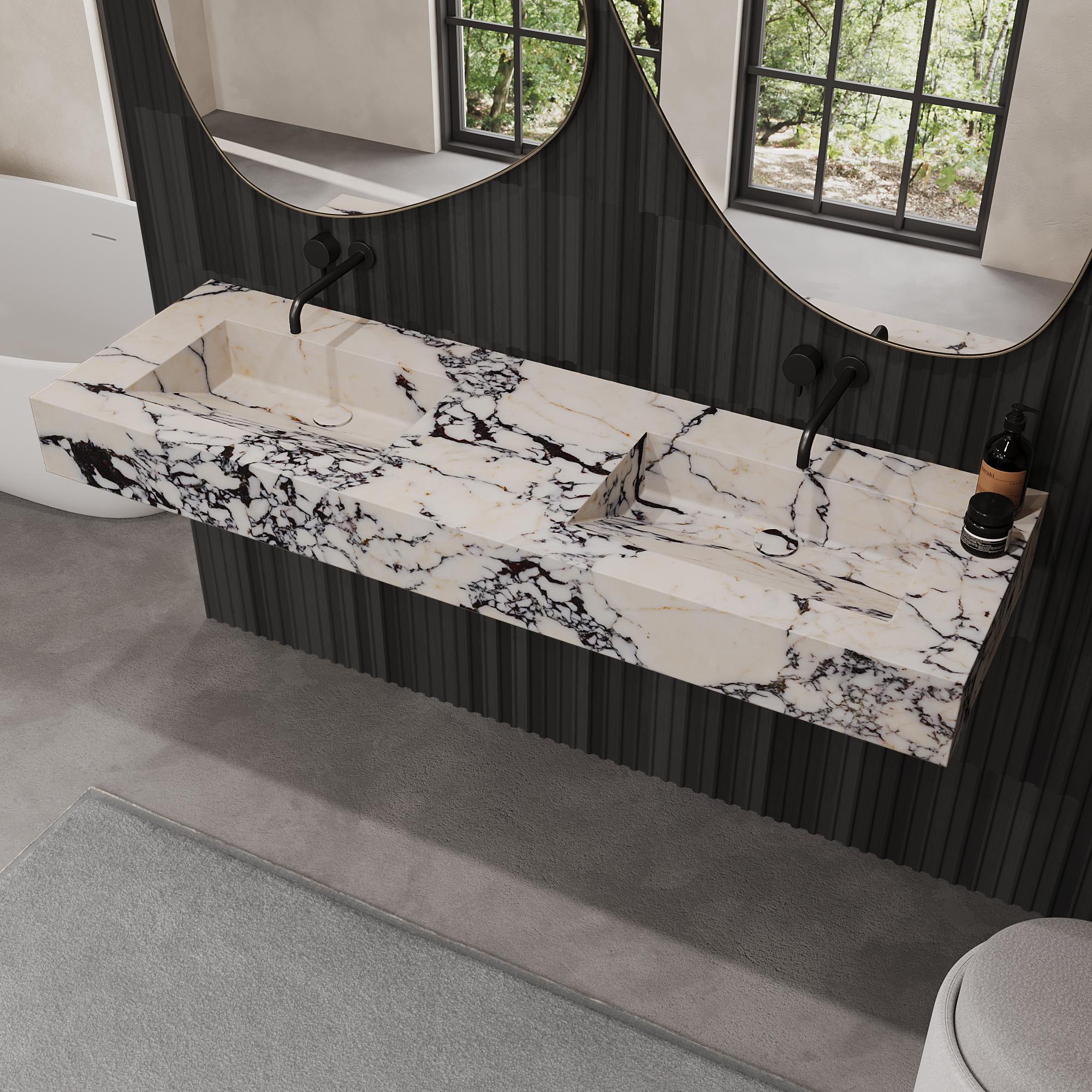 Elevate your bathroom space with our rectangular Skadi Dual Marble Basin, a perfect fusion of minimalist design and natural elegance. Its smooth, honed surface highlights the unique veining and texture of the marble, ideal for modern bathrooms