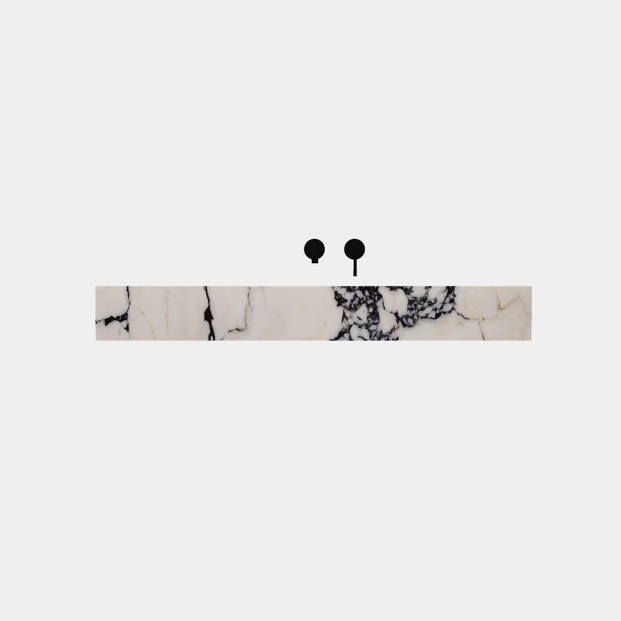 Elevate your bathroom space with our rectangular Skadi Marble Basin, a perfect fusion of minimalist design and natural elegance. Its smooth, honed surface highlights the unique veining and texture of the marble, ideal for modern bathrooms seeking a